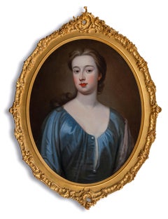 Portrait d'une femme élégante dans une robe en soie bleue, beau cadre ancien, vers 1720
