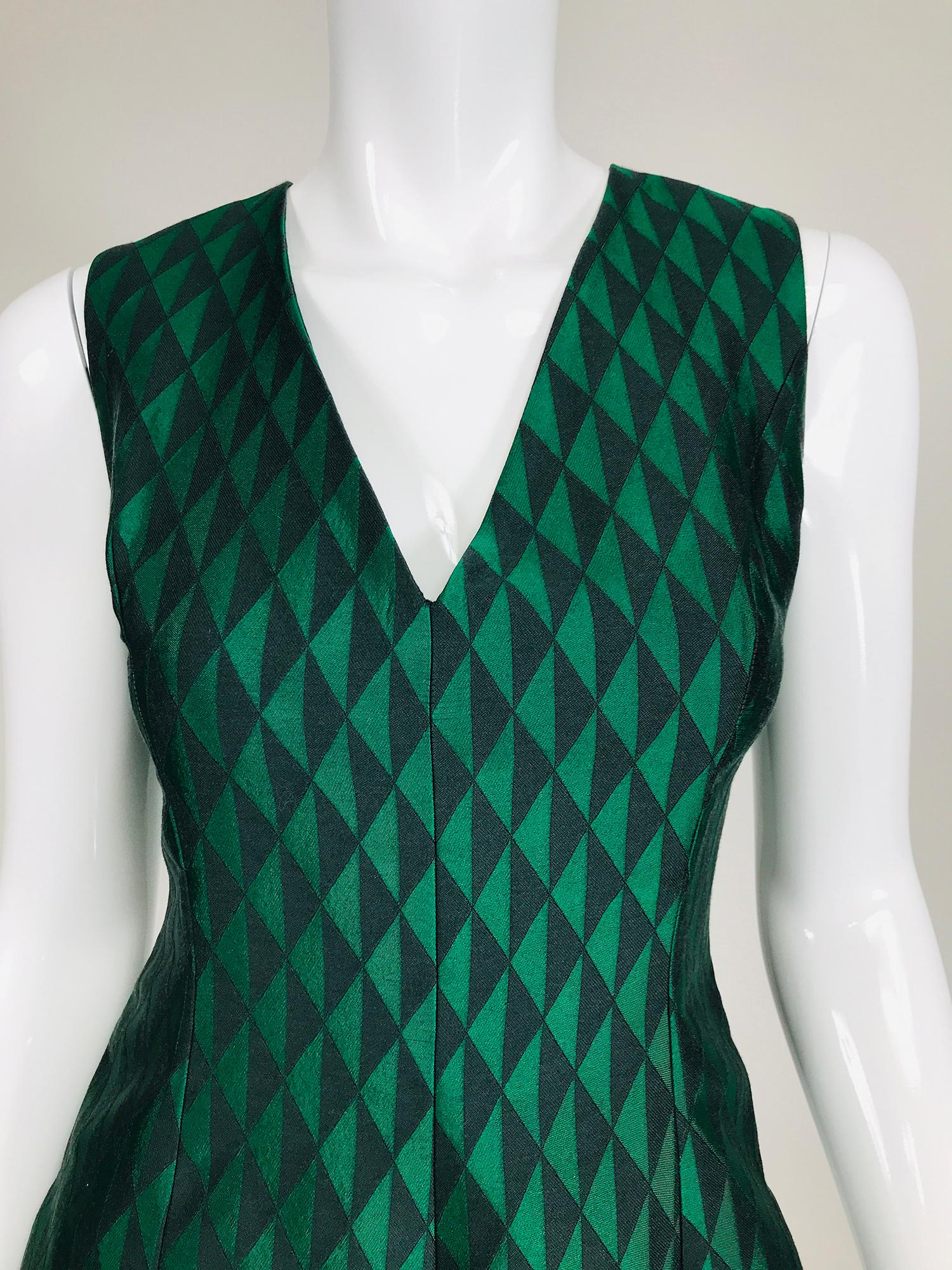 Jonathan Saunders black & green diamond dress. Woven silk & wool sleeveless, V neck dress has princess seams, the skirt is done in inverted pleats. Fully lined in black Bemberg. Closes at the back with an invisible zipper. A beautiful dress for