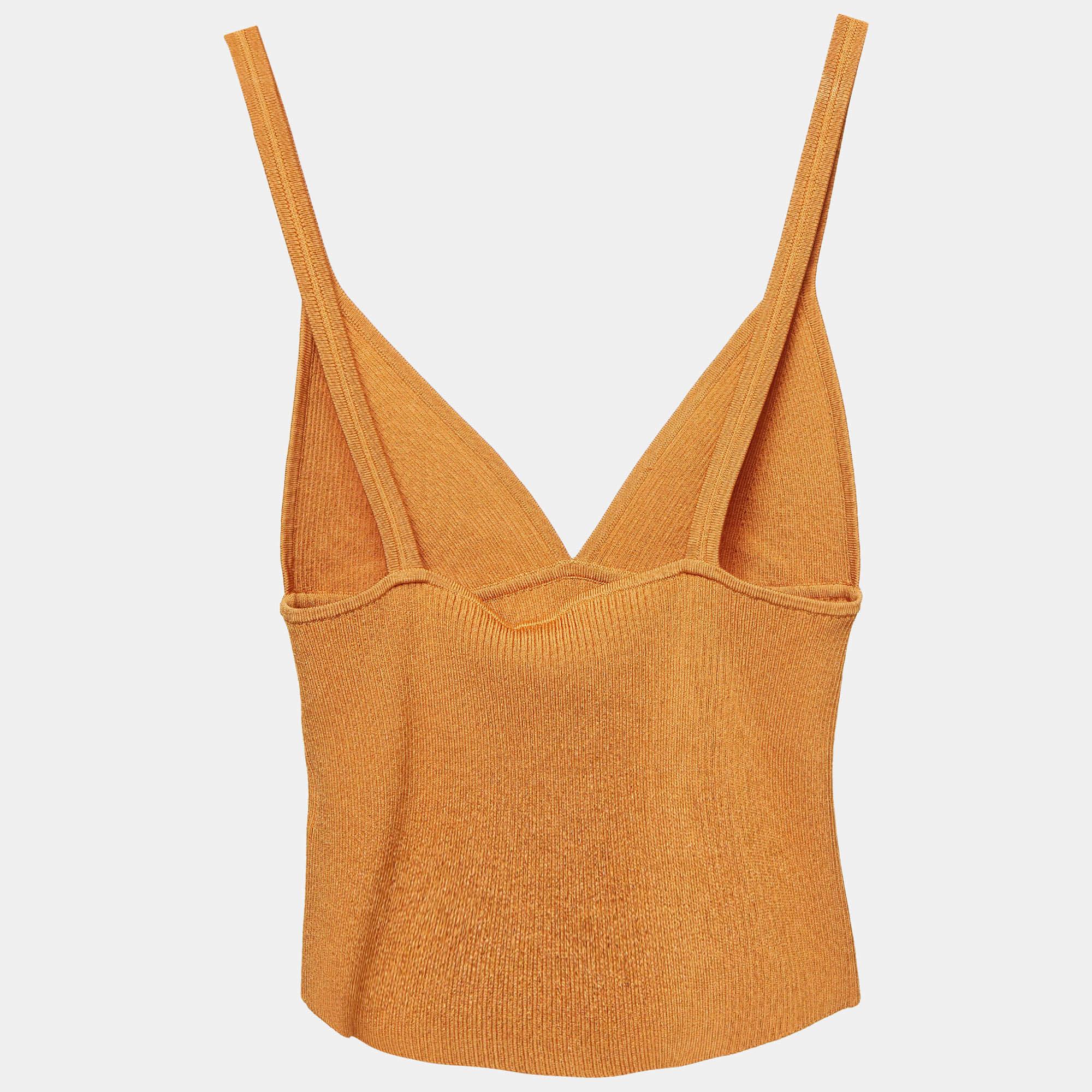 Jonathan Simkhais brown rib knit crop top features sleek cut out detailing  blending modern style with comfort. Crafted from soft  stretchy fabric  this versatile piece is perfect for layering or wearing on its own. The cropped length and rich brown
