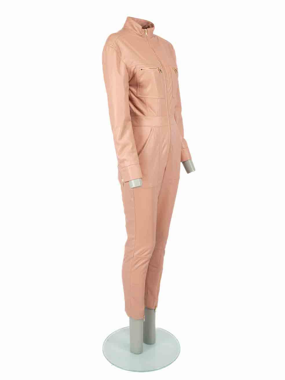 CONDITION is Never worn. No visible wear to jumpsuit is evident on this new Jonathan Simkhai designer resale item.
 
Details
Pink
Faux leather
Jumpsuit
Zip fastening
Zipped cuffs
4x Front pockets
2x Back pockets
Mock neck
Skinny leg
 
Made in China
