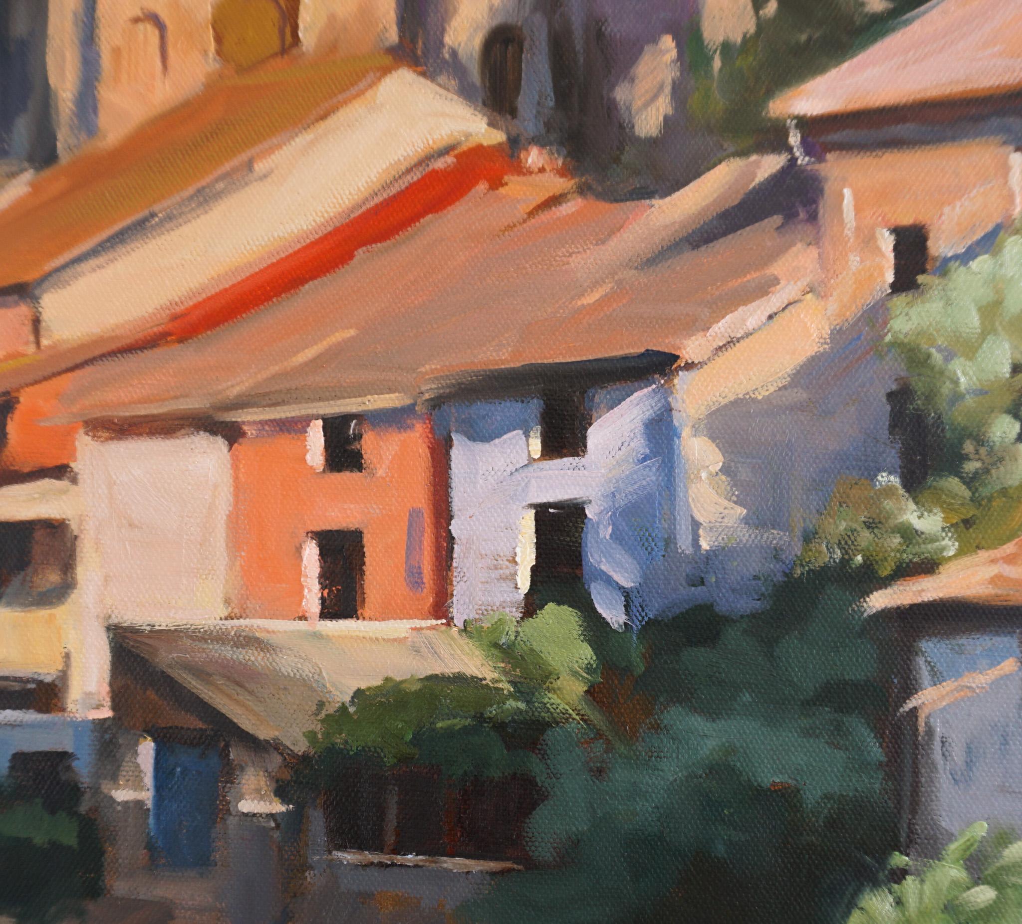 <p>Artist Comments<br />The painting offers a glimpse of the houses surrounding a river in Estella, Spain, a charming town along the Camino de Santiago. The sun casts a warm glow onto the picturesque location, tossing shadows onto apricot-colored