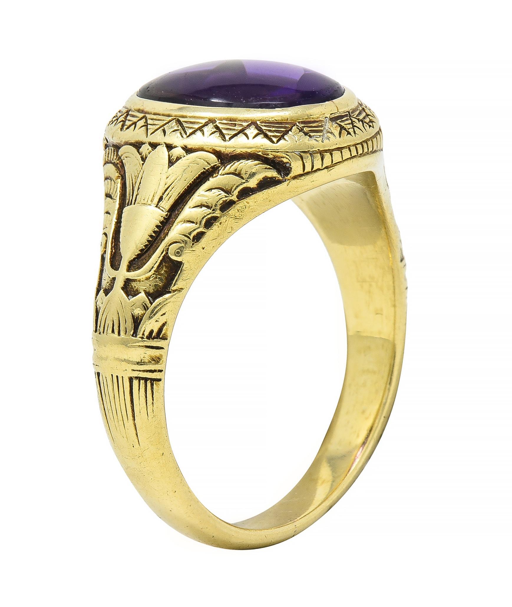 Signet style ring centers an oval amethyst measuring approximately 11.7 x 8.9 mm - translucent uniform purple
With a polished top and faceted pavilion
Bezel set in a deeply etched geometric pattern gold surround
Flanked by highly stylized lotus