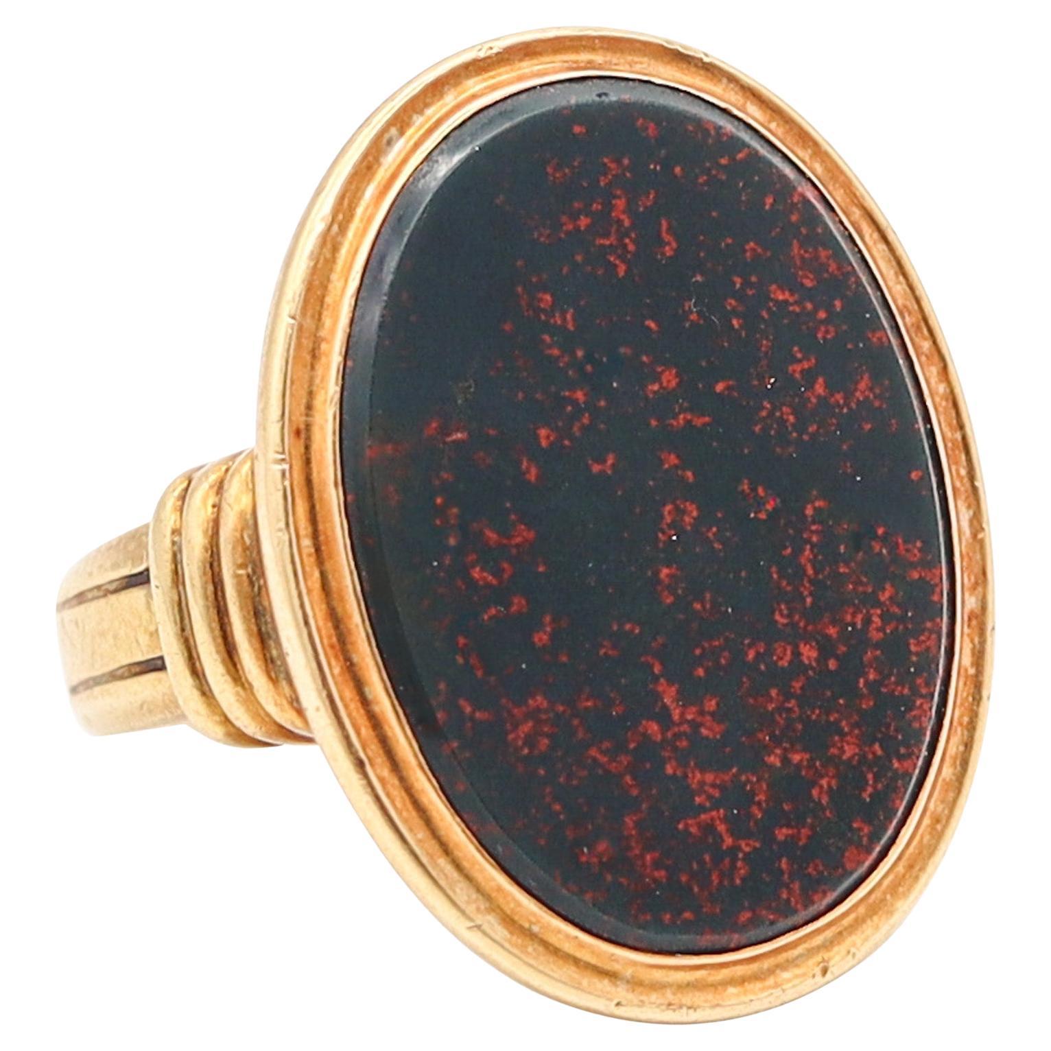 JONES & WOODLAND CO. Anello con sigillo Art Deco del 1930 in oro giallo 14Kt e pietra sanguigna