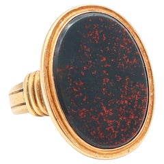 JONES & WOODLAND CO. Anello con sigillo Art Deco del 1930 in oro giallo 14Kt e pietra sanguigna