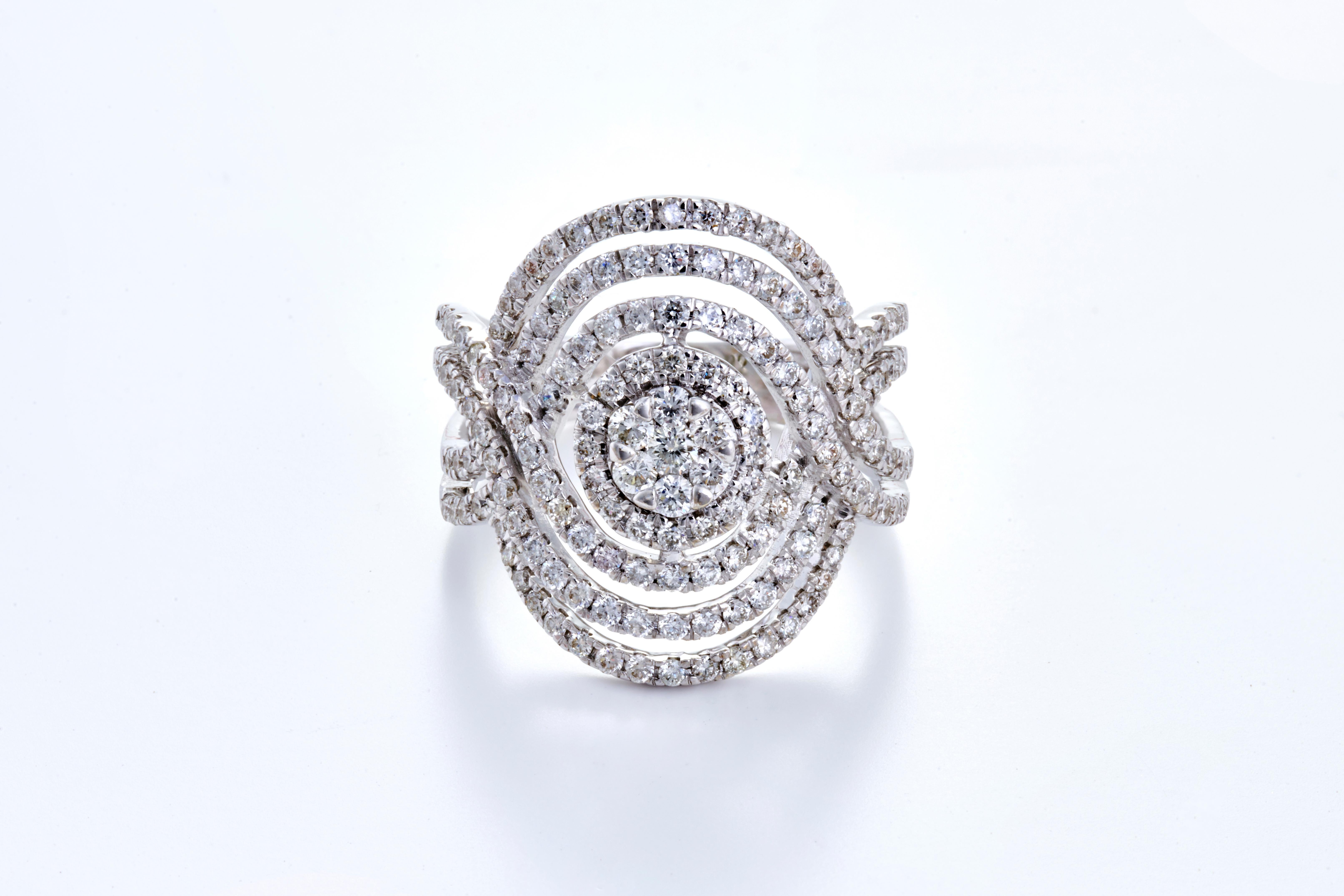 A statement ring of sheer beauty and grace meant for royalty.  Studded with 157 pieces of VS quality and G colour weighing 1.22 carats in 6.91 grams of 18K White Gold. 

These diamonds have been carefully picked and selected from authentic sources