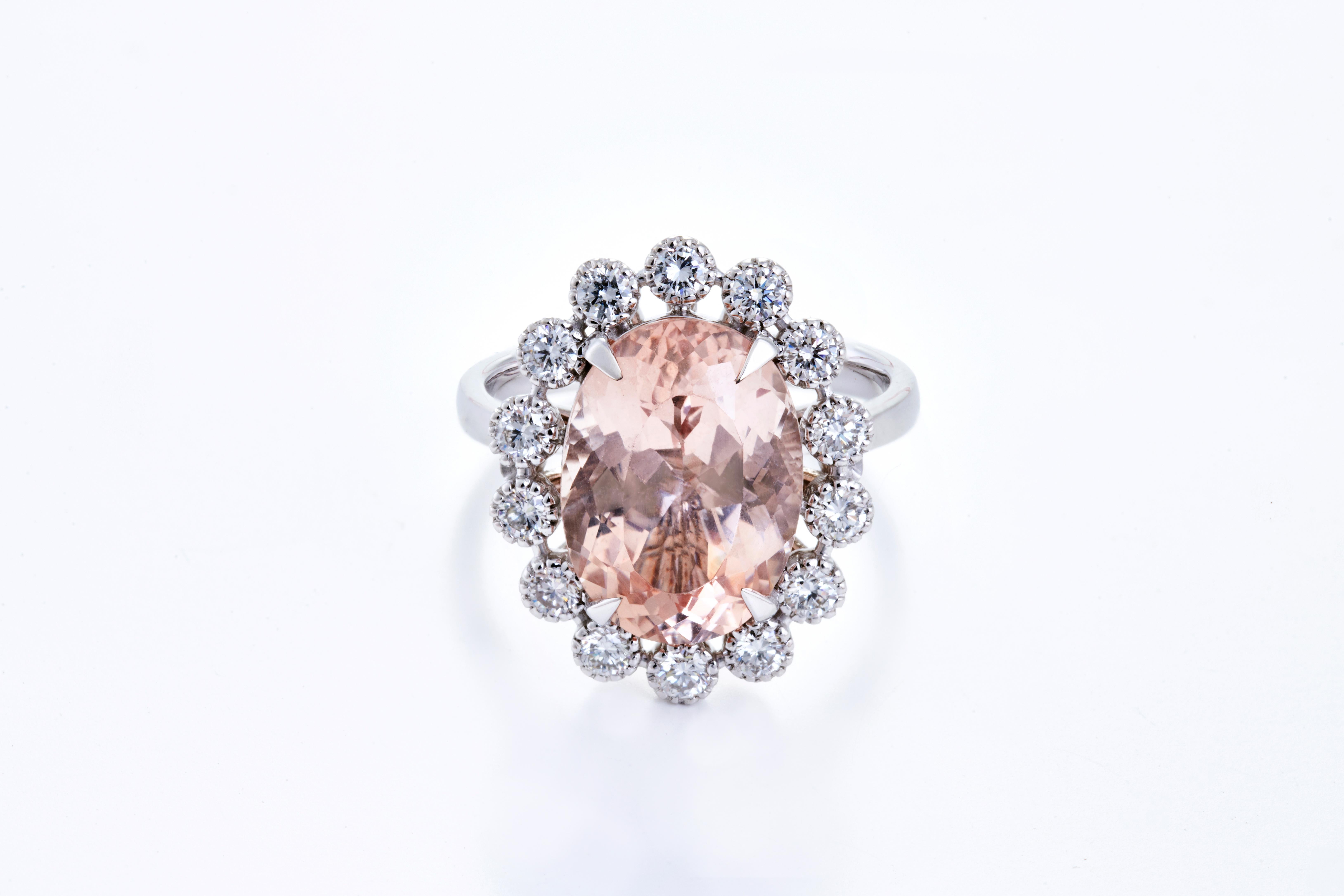 Set in 7.17 grams of 18K White Gold with 14 round cut diamonds around the Gemstone in VS/G quality and colour weighing 0.63 carats. 
Morganites have excellent durability, and enchanting shades of rose pink. Its warm overtones make Morganite