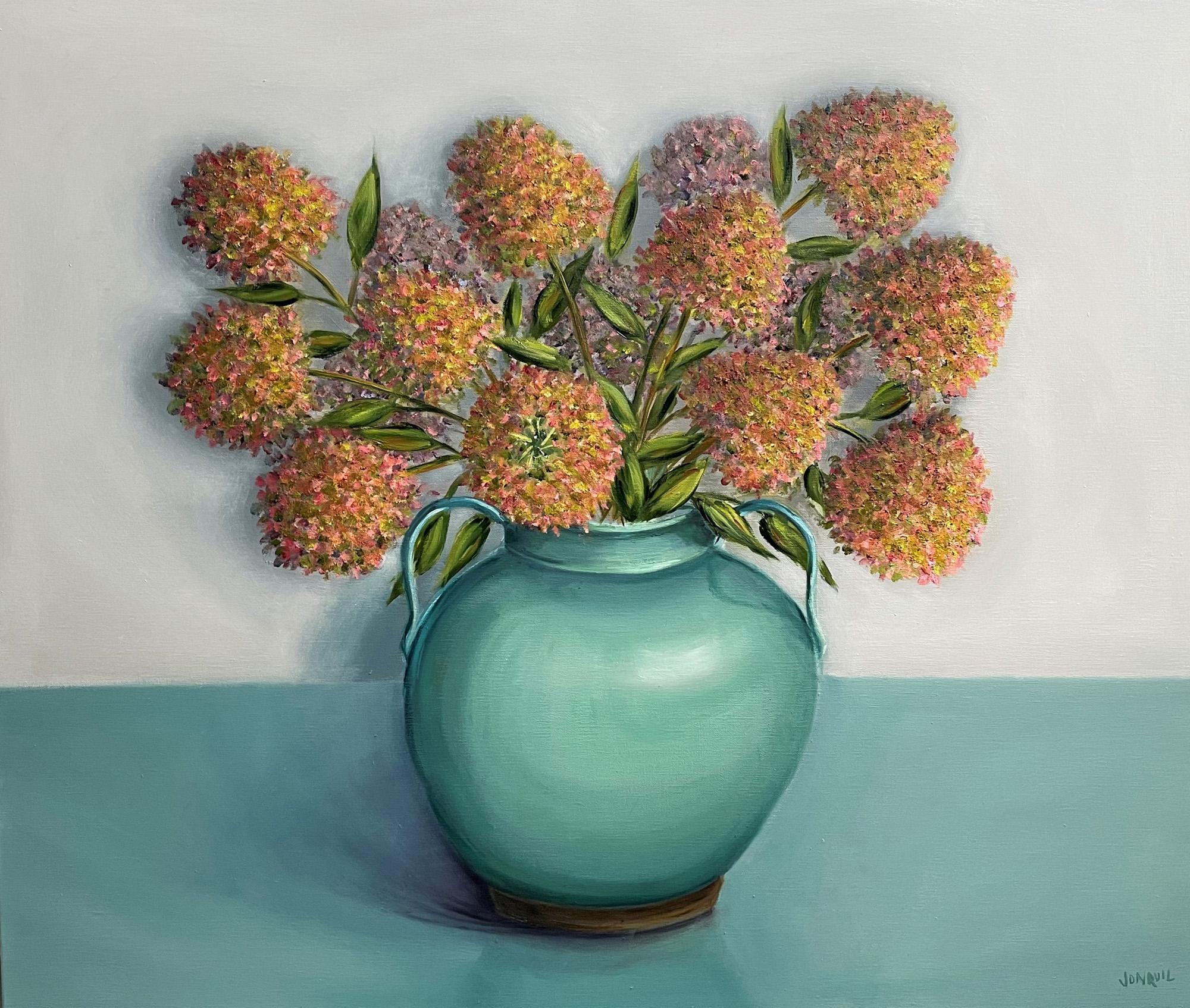 Jonquil Williamson is known for her vibrant still lifes and rich tonal landscapes. Although her work is mostly representational, she allows the mark-making and textures created as she layers the paint, to inform the image.

Of her work she shares,