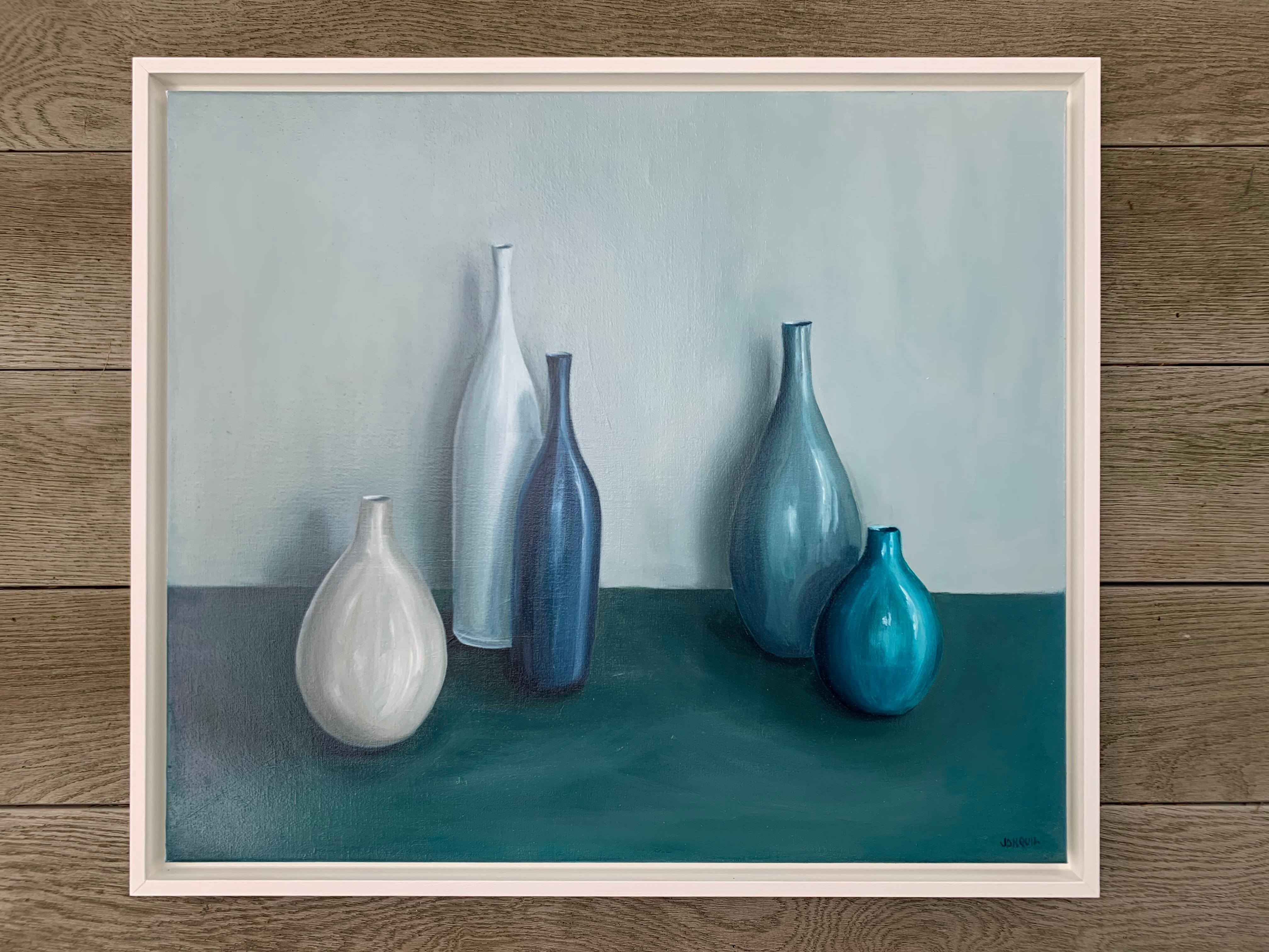A blue and grey family of pots. The colours are serene and calming. The painting is created with a limited palette for tonal harmony.   Oil on canvas framed in painted white frame.


ABOUT JONQUIL WILLIAMSON
Jonquil Williamson is a British artist