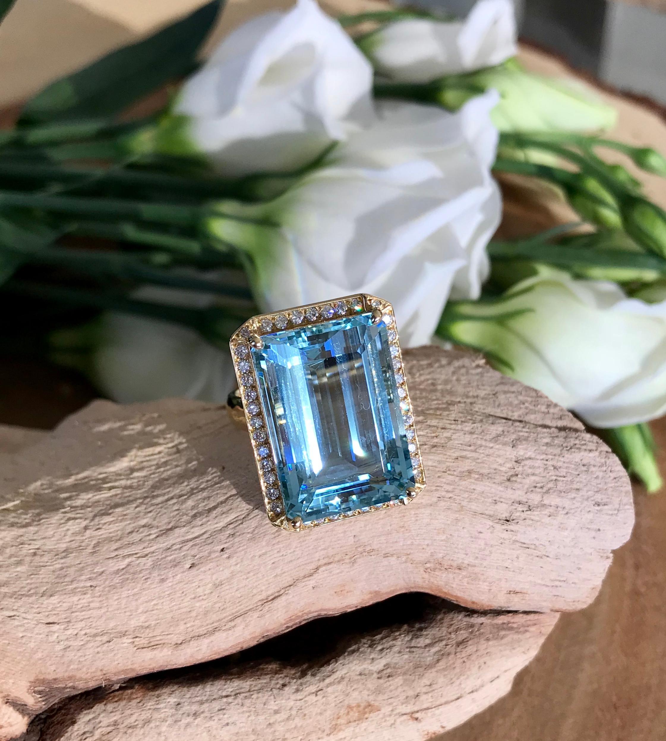 A one-of-a-kind cocktail ring of 19 carats of emerald-cut aquamarine and diamonds, handcrafted in 18 karat yellow gold.

This stunning, substantial Joon Han aquamarine ring is a true statement piece, with 19 carats of a beautiful emerald-cut