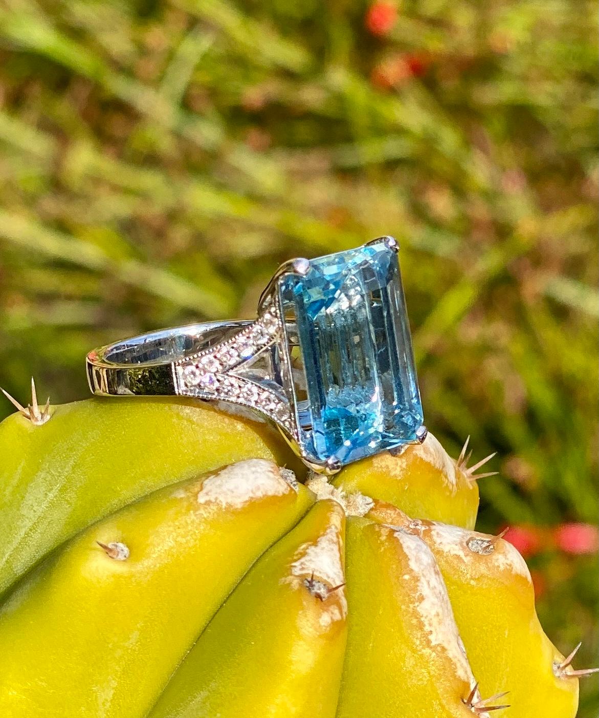 An 8.44 carat emerald-cut aquamarine ring with diamonds, handcrafted in 18 karat white gold.

This beautiful one-of-a-kind emerald-cut aquamarine ring is a vibrant shade of blue, featuring a top quality, clean and brilliant aquamarine gemstone. It