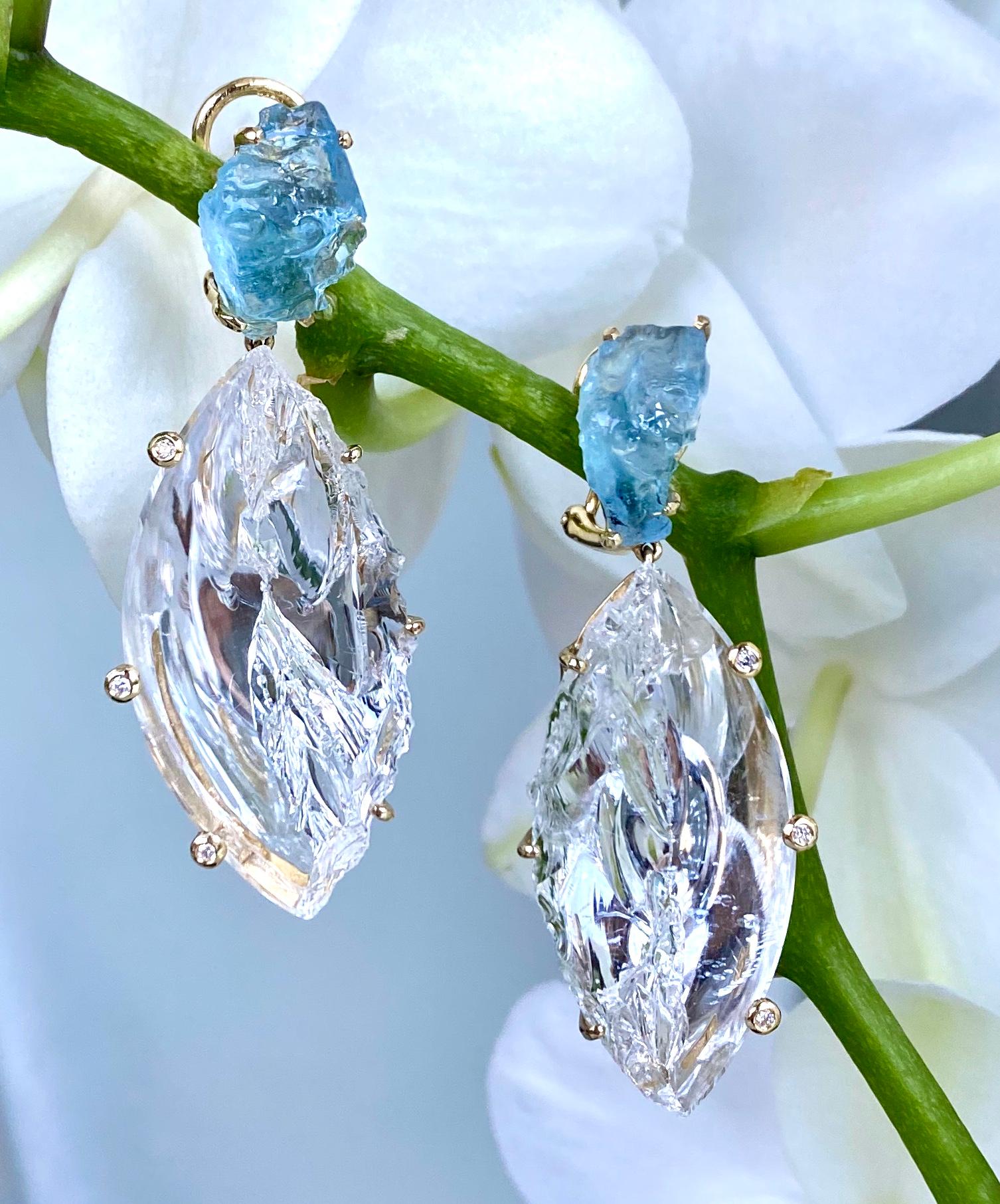 Dangle earrings of natural rough aquamarines, carved white quartz and diamonds, handcrafted in 18 karat yellow gold. 

These unique one-of-a-kind fancy, carved white quartz and rough aquamarine gemstones make an icy statement. Embellished with white