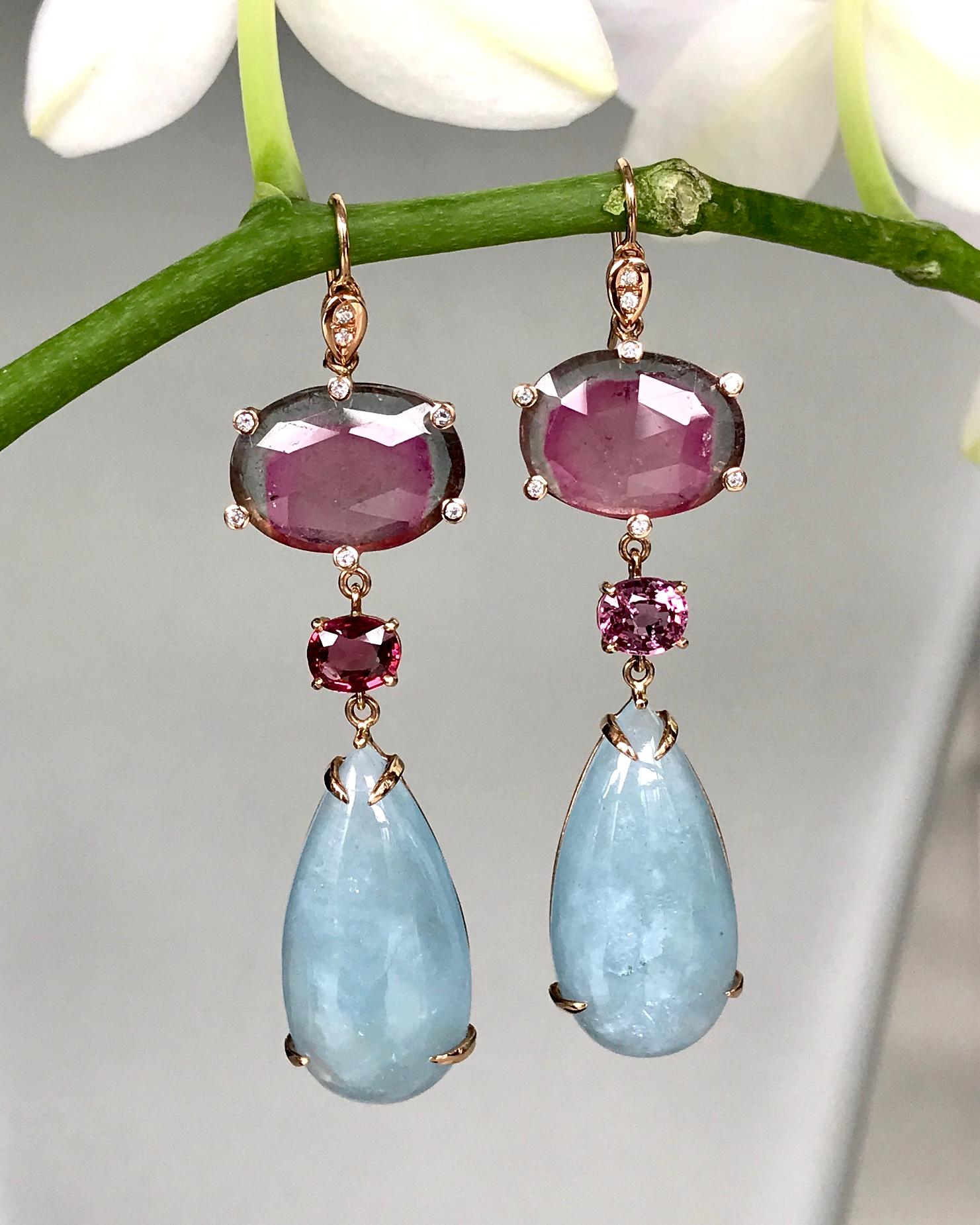 Joon Han one-of-a-kind drop earrings of bicolor watermelon tourmalines accented by white diamonds, faceted pink spinels, and long pear-shaped cabochon aquamarine drops. These glamorous dangle earrings are perfect for those carefree spring and summer