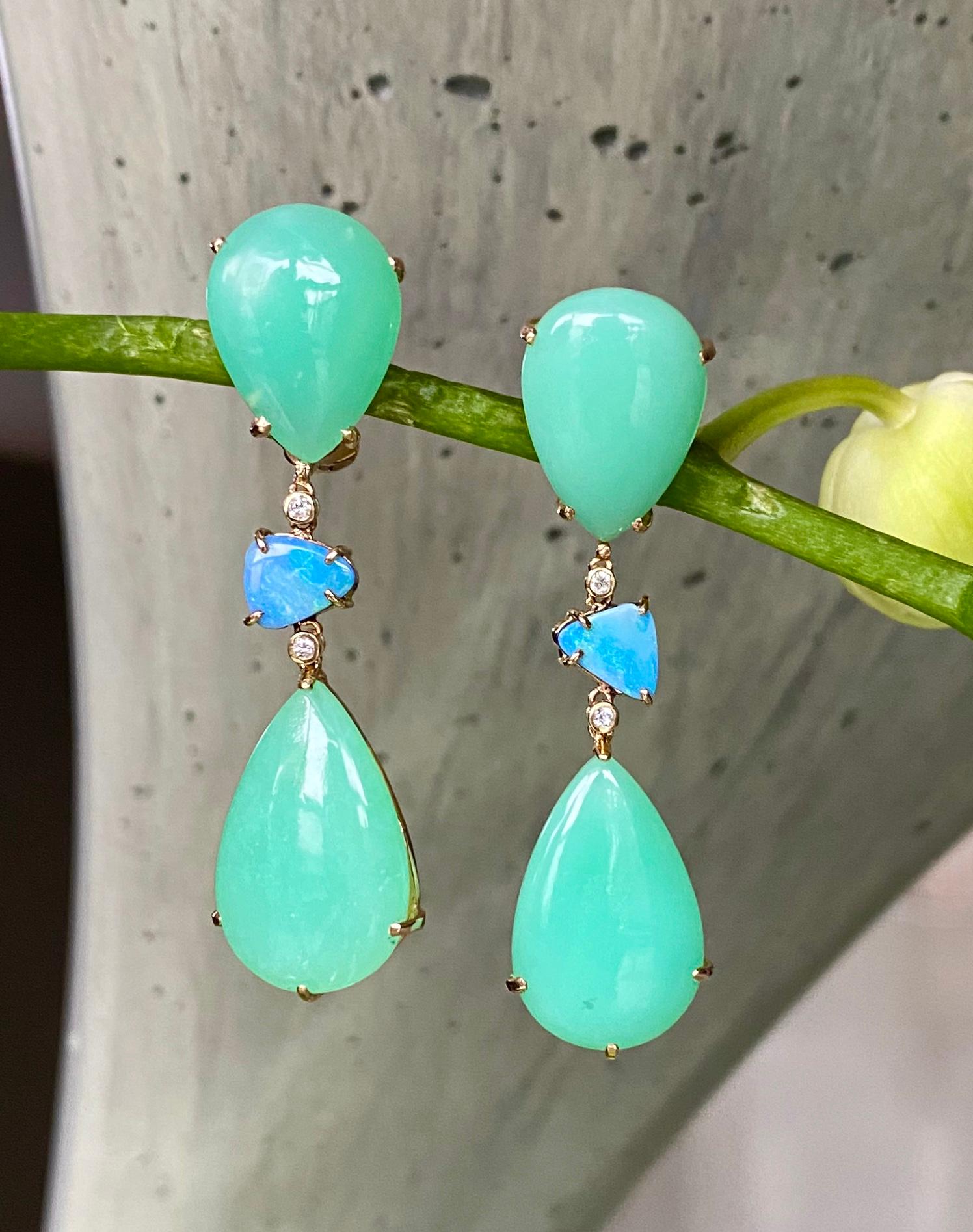 One-of-a-kind drop earrings of chrysoprase, boulder opals and diamonds, handcrafted in 18 karat yellow gold.

These vibrant apple green chrysoprase gemstones, designed with ocean hued boulder opals and diamonds, create a beautiful palette for