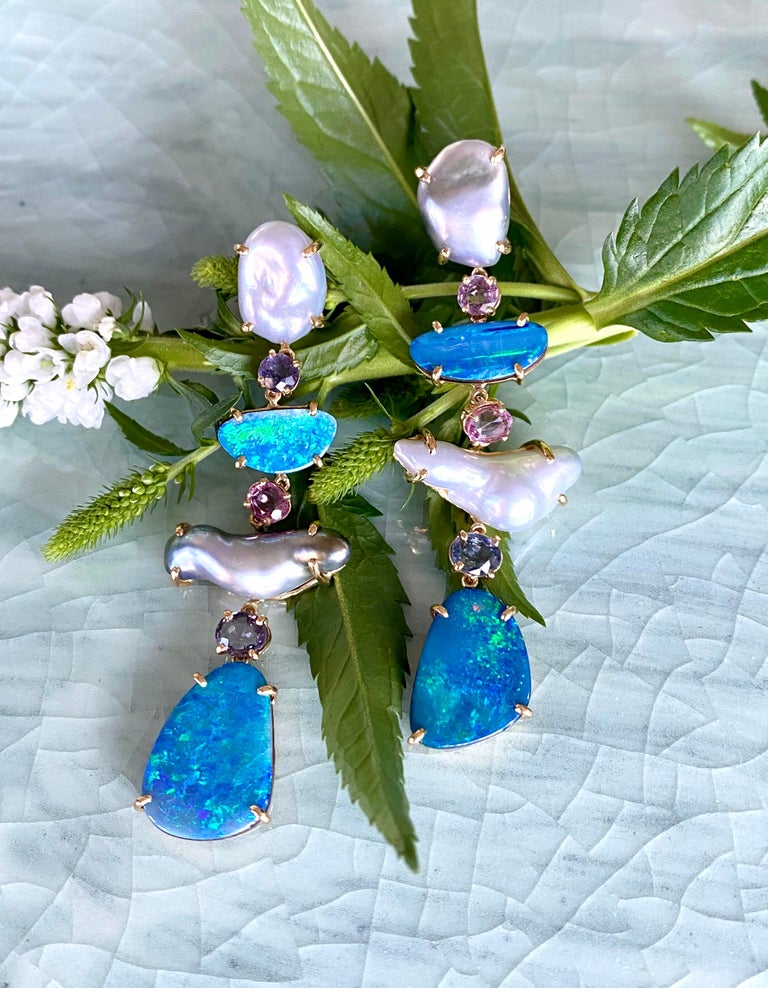 Dangle earrings of keshi pearls, boulder opals and multicolored spinels, handcrafted in 18 karat yellow gold.

These stunning one-of-a-kind dangle earrings feature shimmery, lustrous keshi pearls in natural free form shapes paired with the vibrant