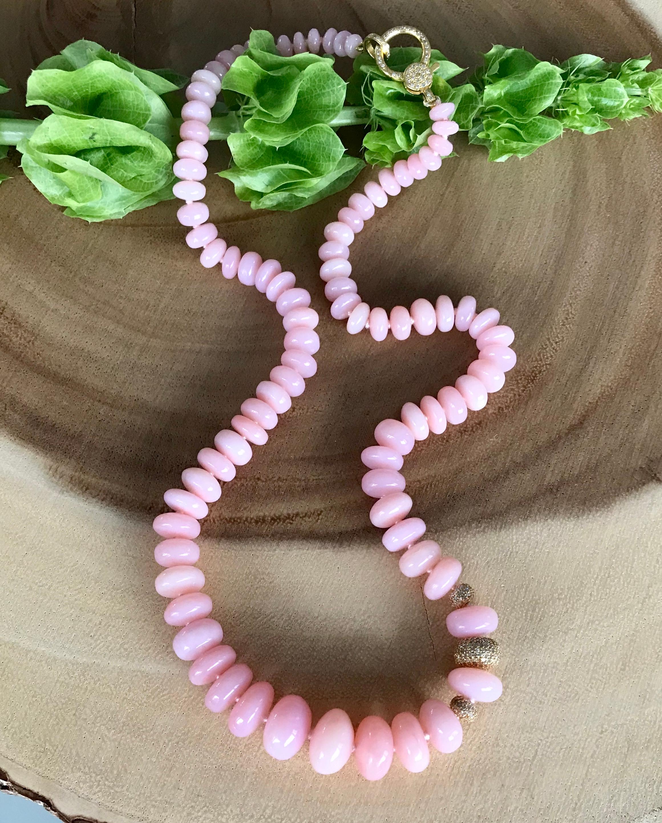 One-of-a-kind smooth pink opal beaded necklace with three diamond beads set in 14 karat yellow gold, with a 14 karat yellow gold and diamond clasp.

This beautiful pink opal beaded necklace with 3 diamond beads and a diamond clasp is a wonderful