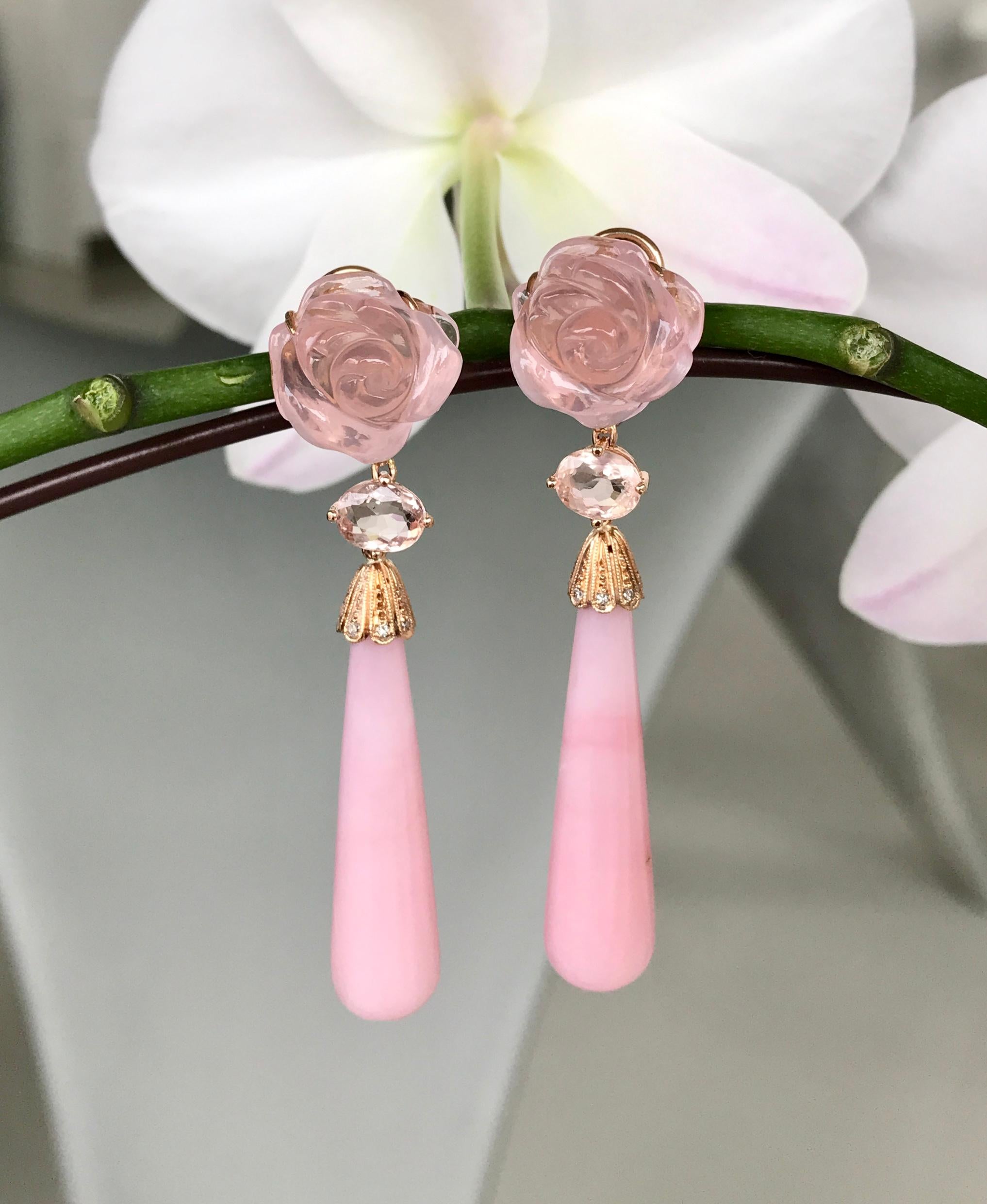 Earrings of rose quartz carved roses, tourmalines, pink opal drops and diamonds, handcrafted in 18 karat rose gold.

These exquisite one-of-a-kind dangle earrings of pink opals are paired with carved roses in rose quartz, pink tourmalines, and white