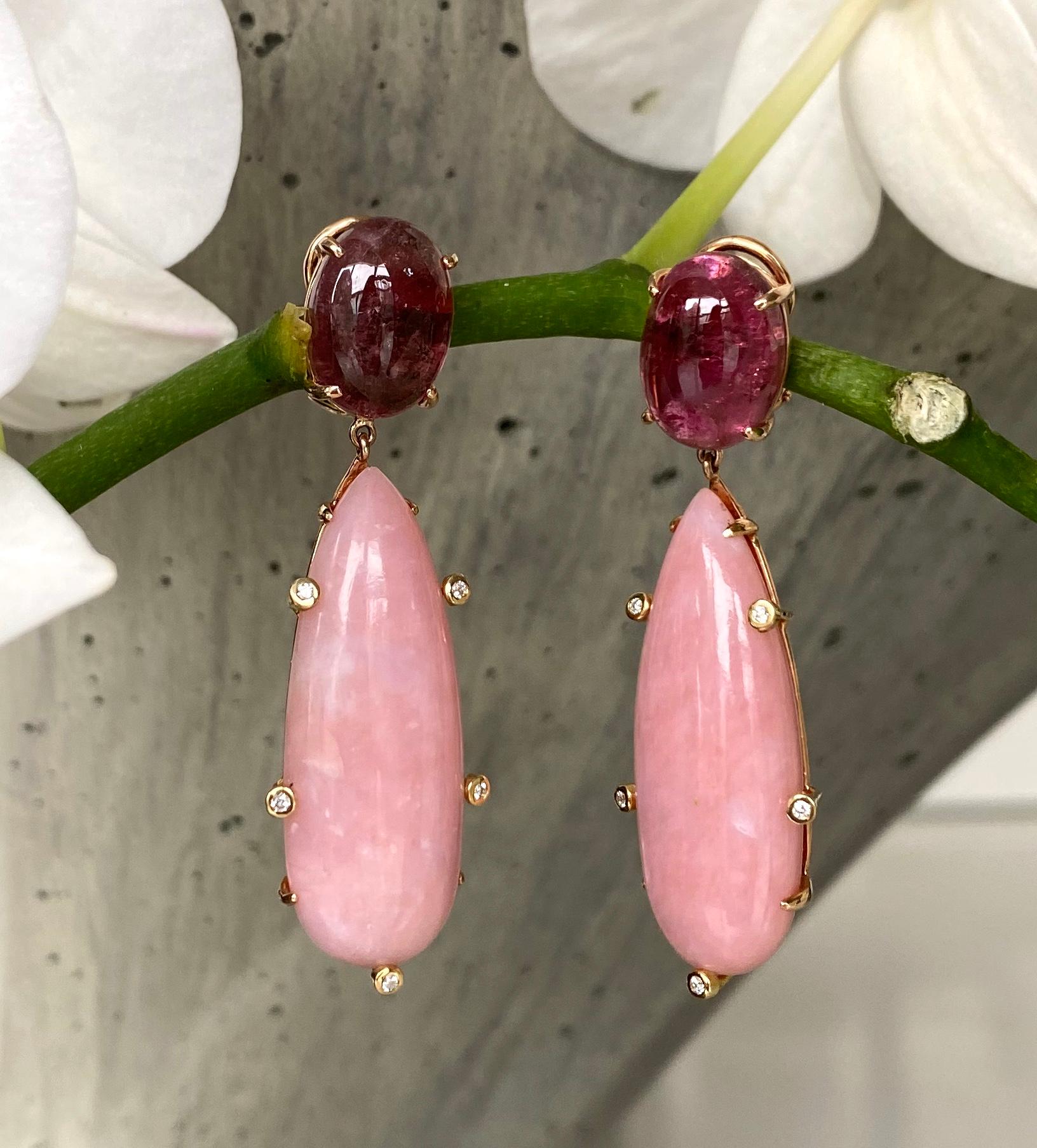 Dangle earrings of cabochon pink tourmalines and pink opal elongated drops accented with diamonds, handcrafted in 18 karat rose gold.

These lovely one-of-a-kind earrings feature luminous oval cabochon pink tourmalines and long teardrop shaped pink