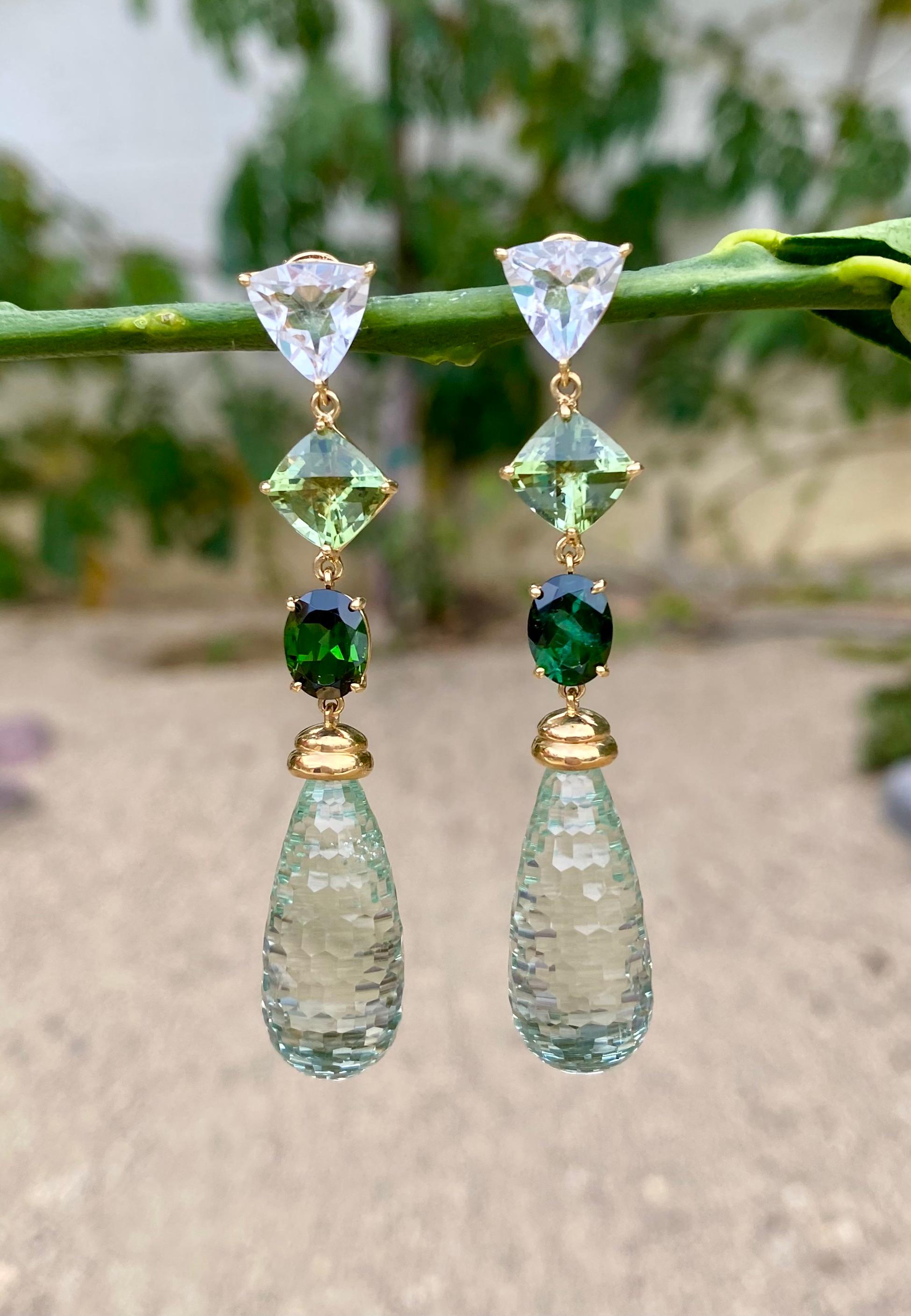 Prasiolite briolette drop earrings with beautiful shades of blue and green tourmalines and white topaz, handcrafted in 18 karat yellow gold.

Gorgeous shades of green are reflected in these stunning one-of-a-kind prasiolite briolette and