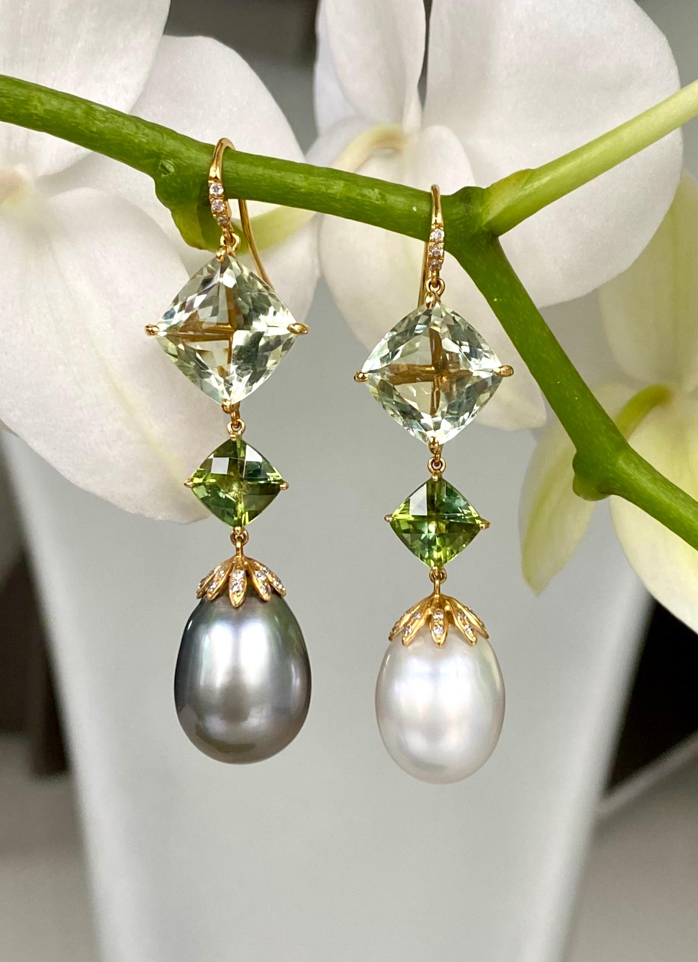 One-of-a-kind earrings of prasiolites, green tourmalines, South Sea and Tahitian pearls, and diamonds, handcrafted in 18 karat yellow gold.

These beautiful drop earrings boast perfectly mismatched grey Tahitian and white South Sea pearls, with