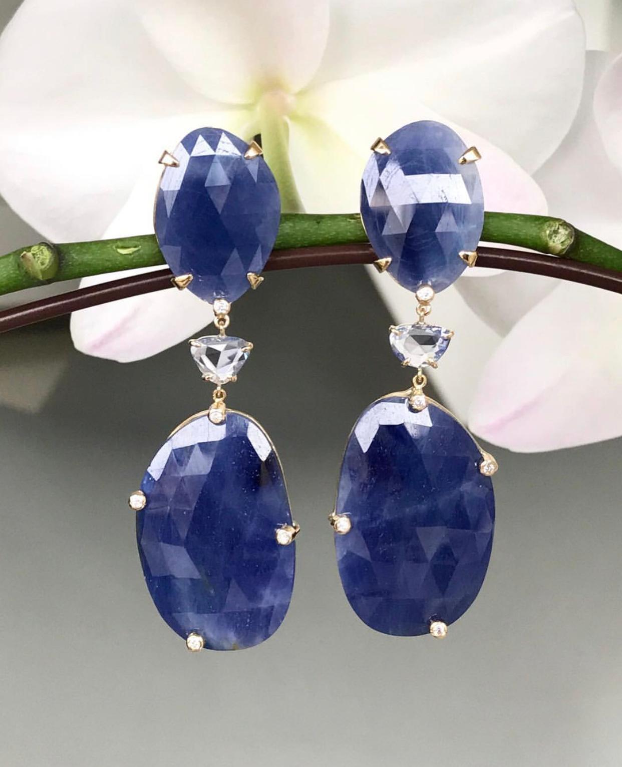 Rose cut blue sapphire statement earrings with diamond accents, handcrafted in 18 karat yellow gold. 2.83 inches or 72 mm length.

These elegant one-of-a-kind earrings can be dressed up with a lovely cocktail dress or dressed down and worn with a