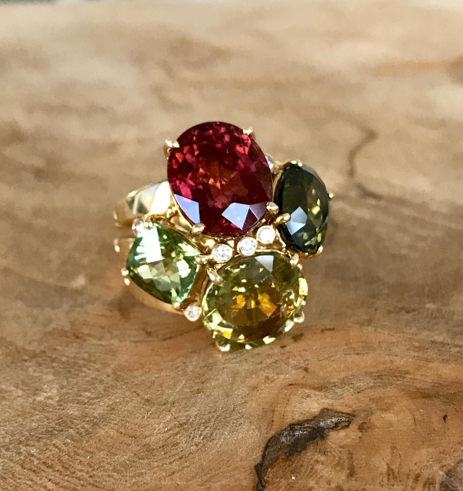 A multi-gemstone cluster cocktail ring with rubellite and green tourmalines and diamonds, handcrafted in 18 karat yellow gold.

This gorgeous one-of-a-kind Joon Han statement ring of four multicolored tourmalines in different shapes and colors, with