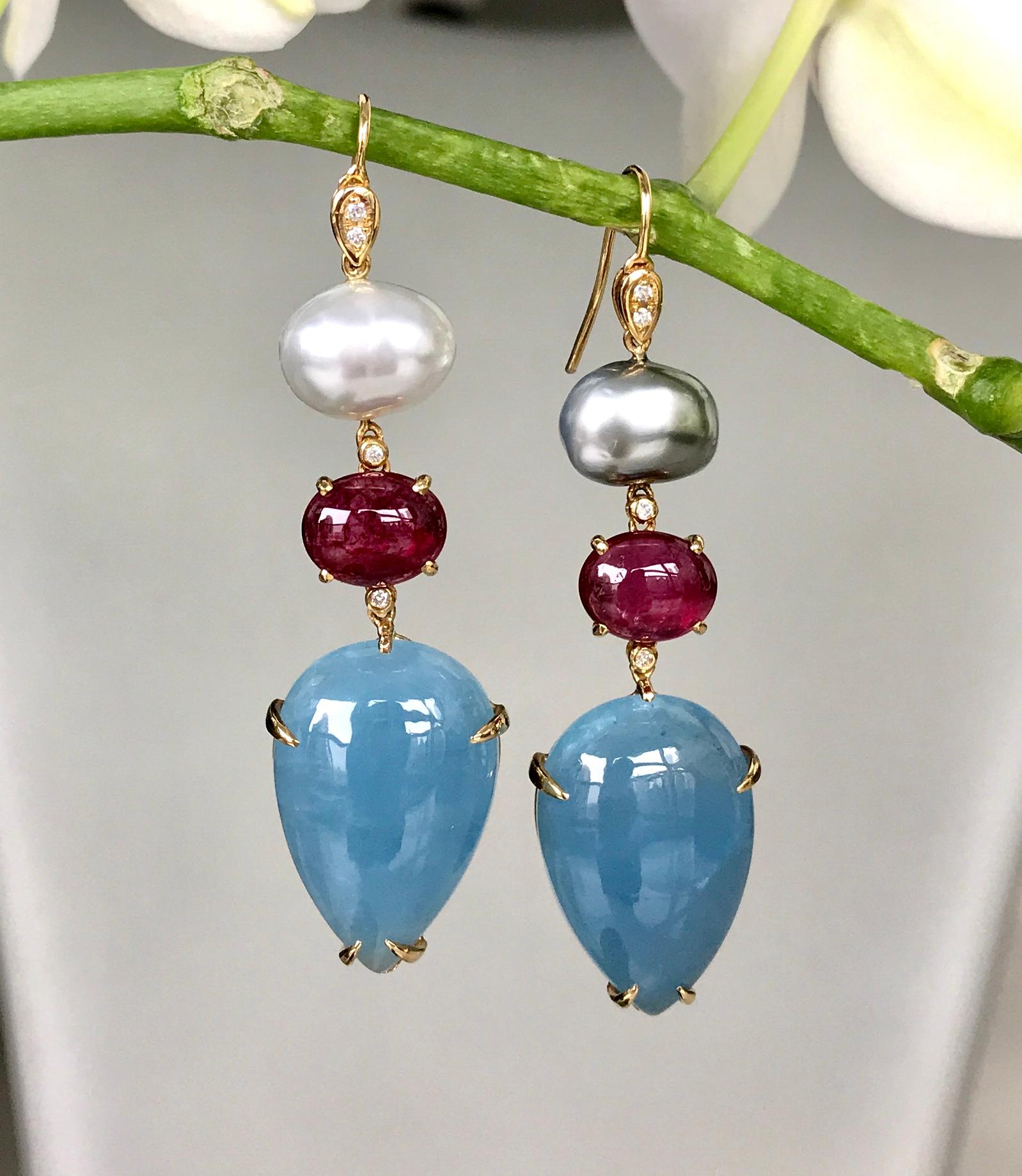 Joon Han one-of-a-kind dangle earrings of South Sea and Tahitian cream and grey keshi pearls, cabochon rubellite tourmalines, fancy cabochon aquamarine drops, and diamonds. Handcrafted in 18K yellow gold, these luminescent earrings are a chic and