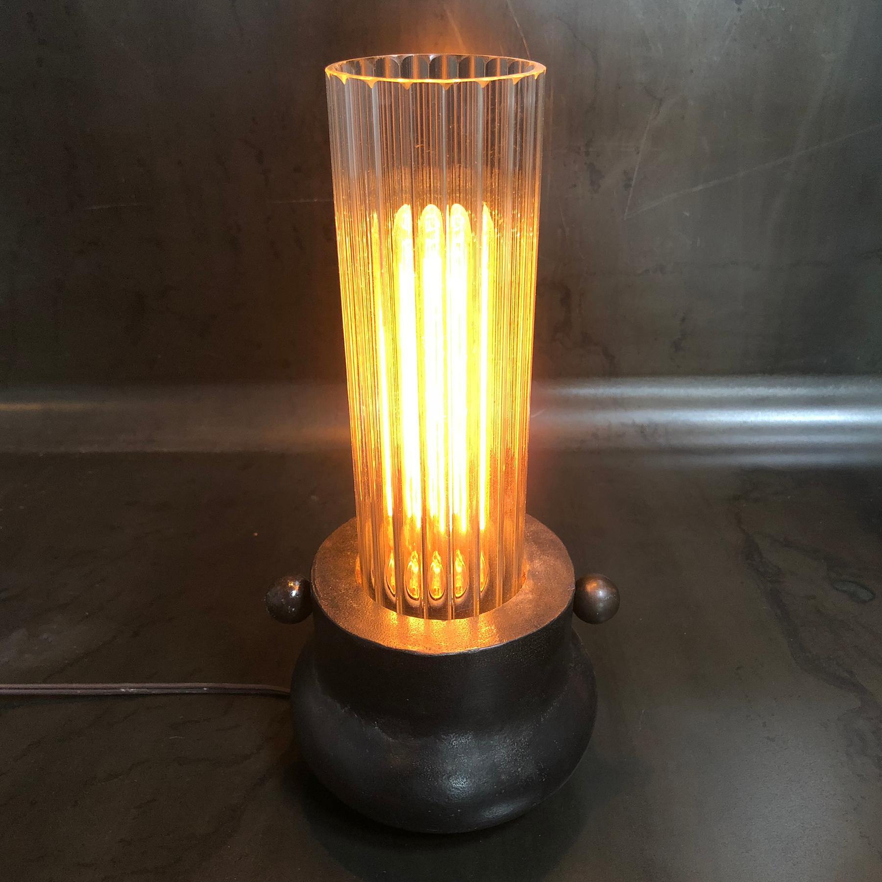 Jordan Mozer (b.1958) : Victory Boudoir Lamp, Cast Aluminum + Fluted Glass Tube, Made in Chicago, USA, 2013. Provenance: collection of the artist. Signed. 
Measurements: 5.5” diameter x 12” tall (14 cm diameter x 30.5  cm tall)

.MATERIALS +