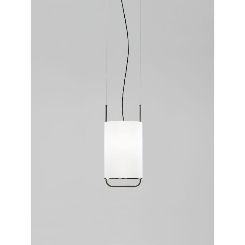 Alistair T

Suspension lamp, model Alistair T, designed by Jordi Vaciana in 2013.
Manufactured by Parachilna.

Structured in golden or graphite matt electroplated steel. Cylindrical diffuser in blown opal matt glass. 
Canopy in white matt lacquered