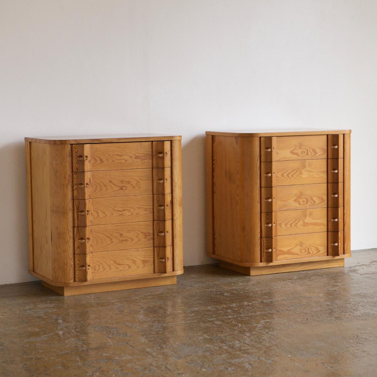 A truly beautiful pair of chests by Spanish designer Jordi Vilanova i Bosch dated 1960's. The pair are made from pine and the designer has made a feature of the grain across each of the 5 drawers. The handles have a sculpted feel with an integral