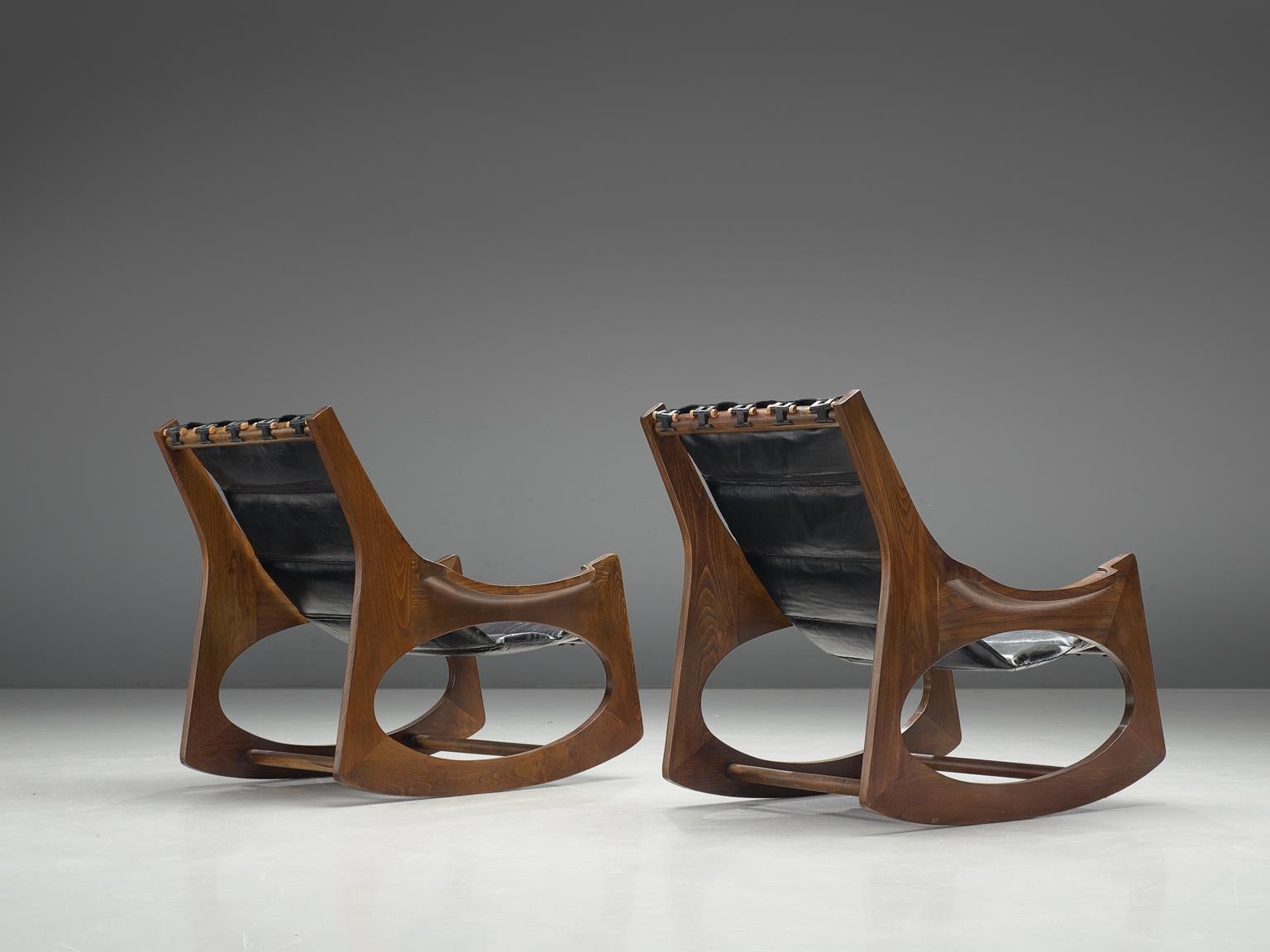 Jordi Vilanova i Bosch, pair of rocking chairs, leather and walnut, Spain, 1960s

This pair of rocking chairs are designed by Jordi Vilanova i Bosch in the 1960s. Beautiful carved frame with a nice balance between rounded and sharp forms. Very