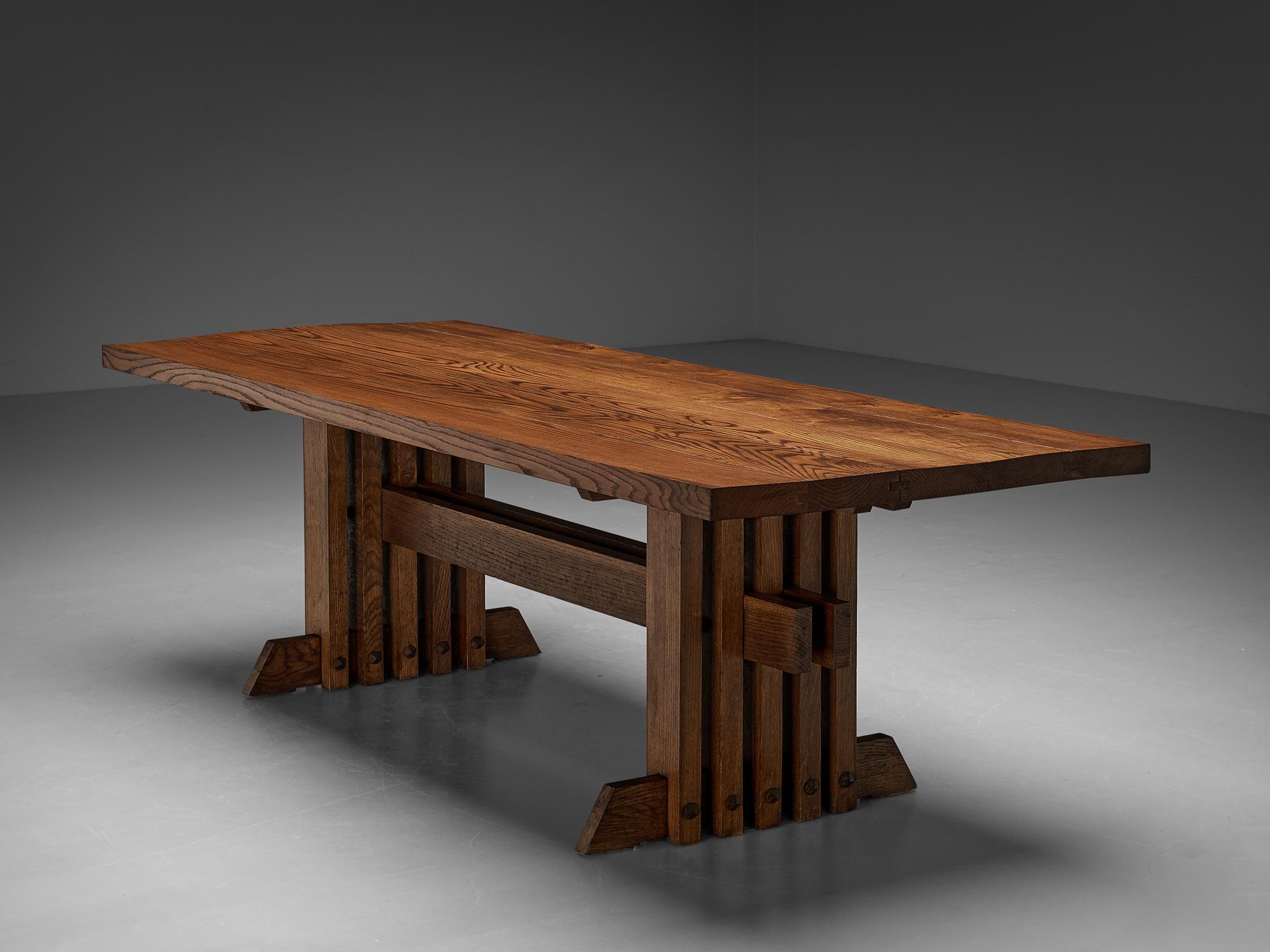 Jordi Vilanova I Bosch, dining table, oak, iron, Spain, 1960s.

This table is solid, architectural and robust. Design qualities that are both typical for Spanish midcentury design and especially for the works of Jordi Vilanovo. Although his work is