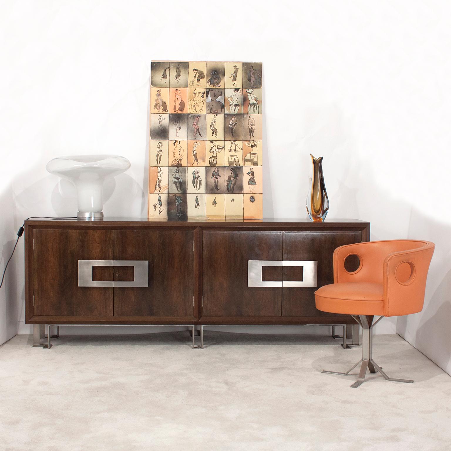 Sideboard designed by Jordi Vilanova in 1970s. Famous interior and furniture designer from Barcelona, 1960s-1970s.
Stained and French polished walnut veneer. Nickel-plated solid brass feet.
Good quality furniture, interior very well