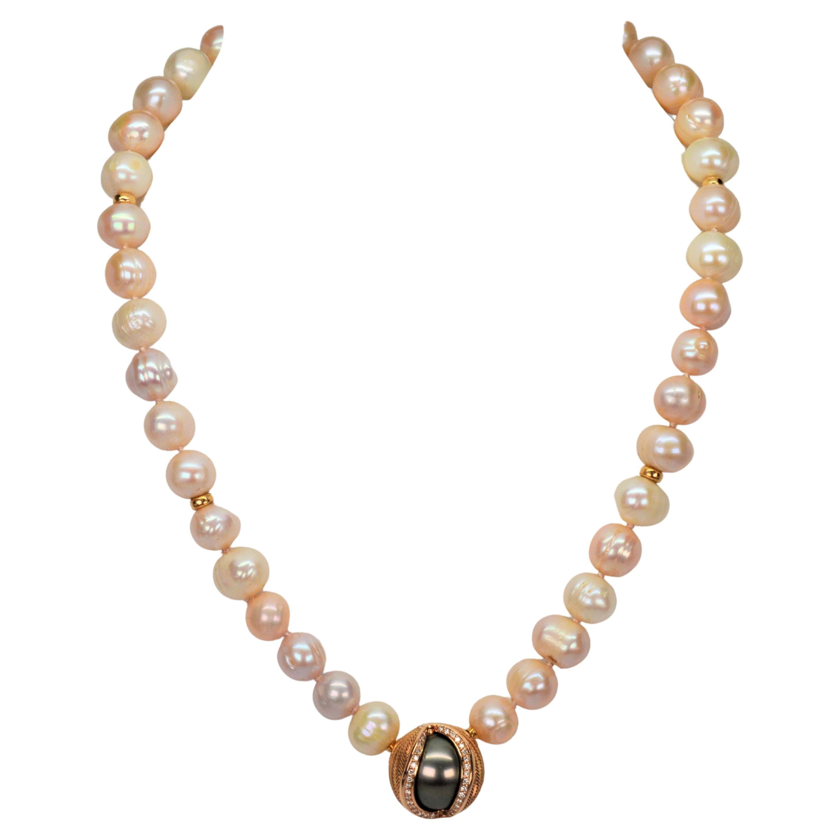 Outstanding design by genius jewelry mechanic Jorg Heinz. This lovely 15 inch pastel-hue pearl strand features his proprietary unique mystery sphere clasp, inter-changible by the three position click of the 18 karat gold shell which gives the option