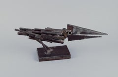 Jörg Jeschke, Austrian sculptor. Metal sculpture of a bird on a pedestal.