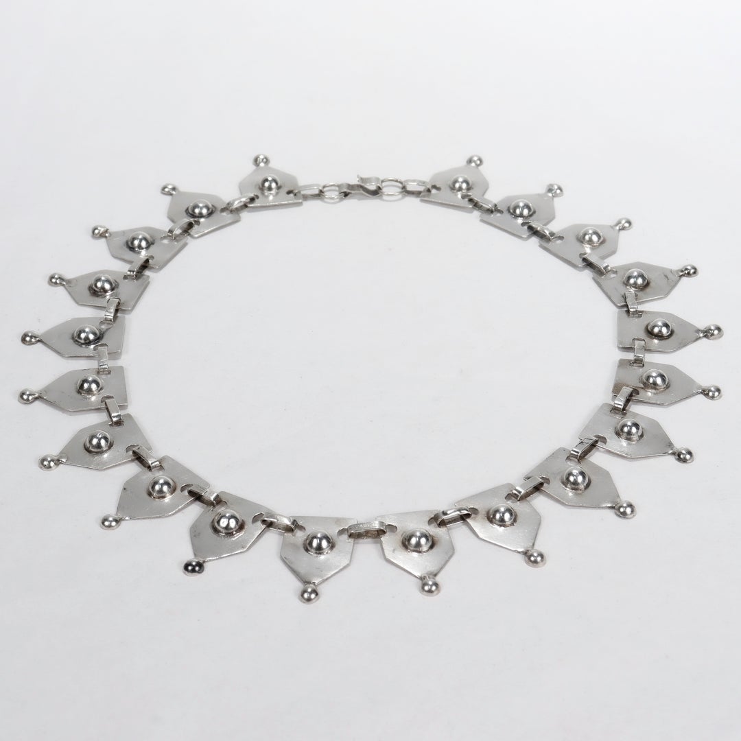 A fine early Mexican silver fanned panel collier necklace.

Attributed to Chato Castillo.

In what we've seen referred to as his 