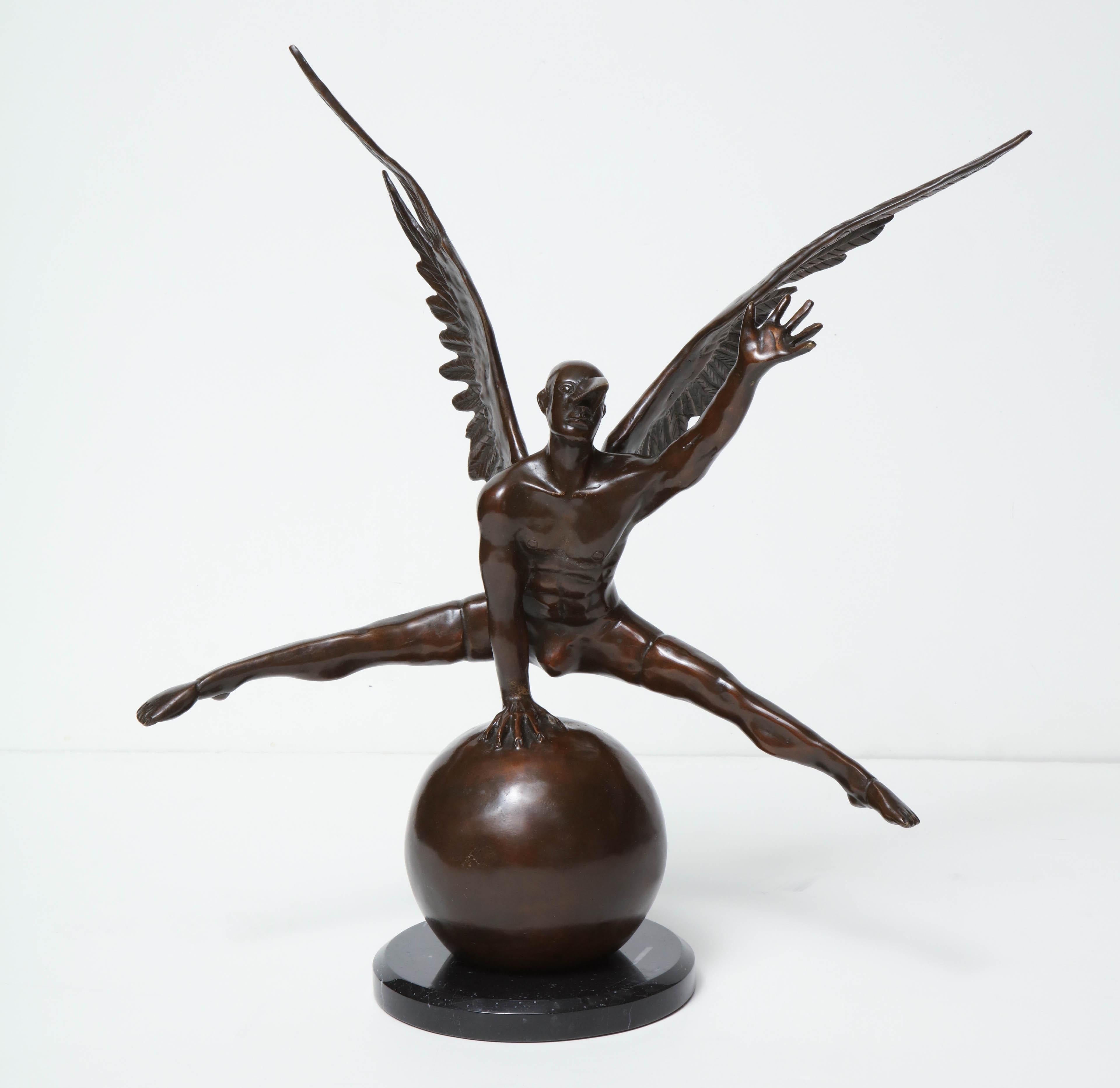Jorge Marin signed bronze figure on a ball with carnival mask.