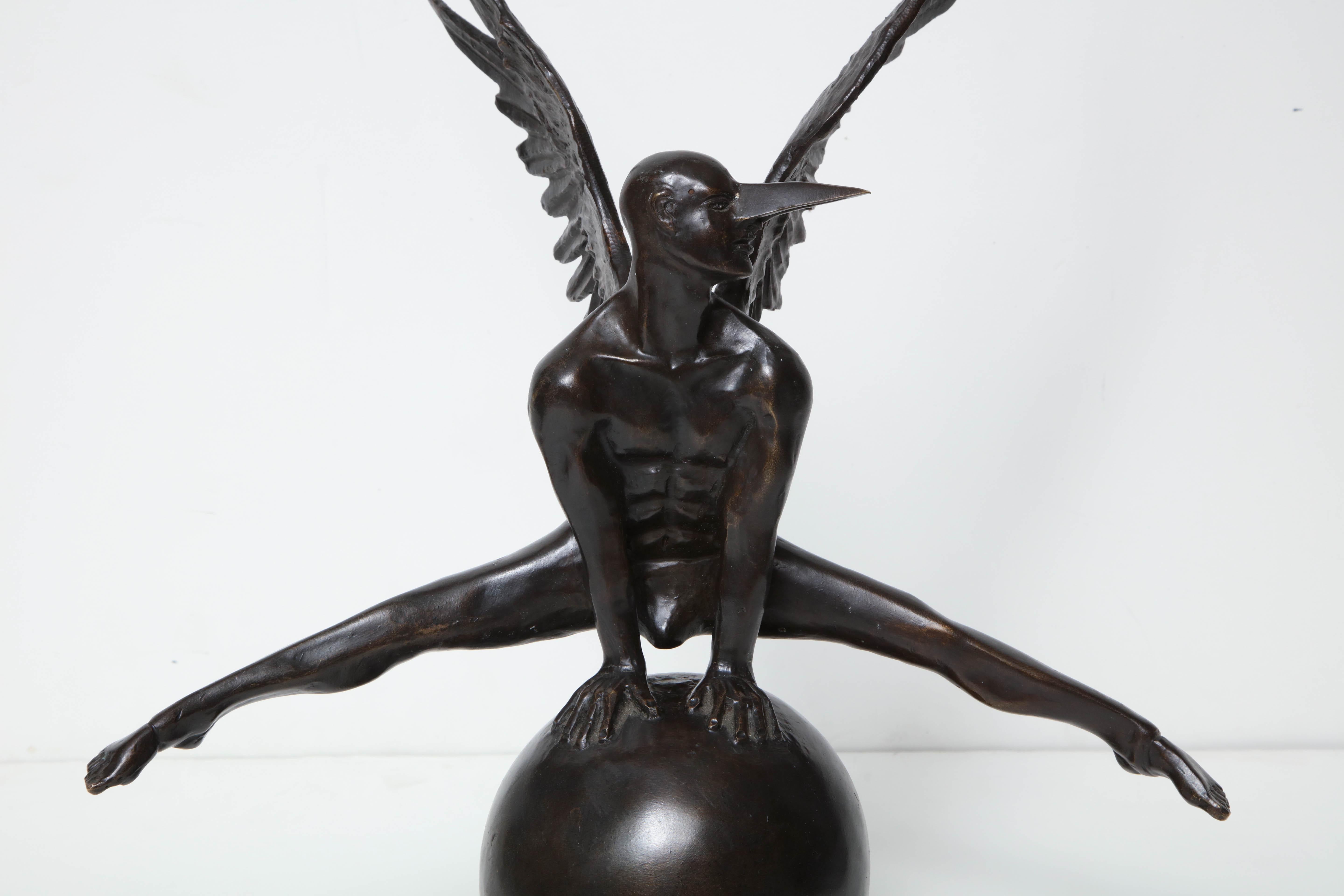 Jorge Marin signed bronze figure on a ball with carnival mask.