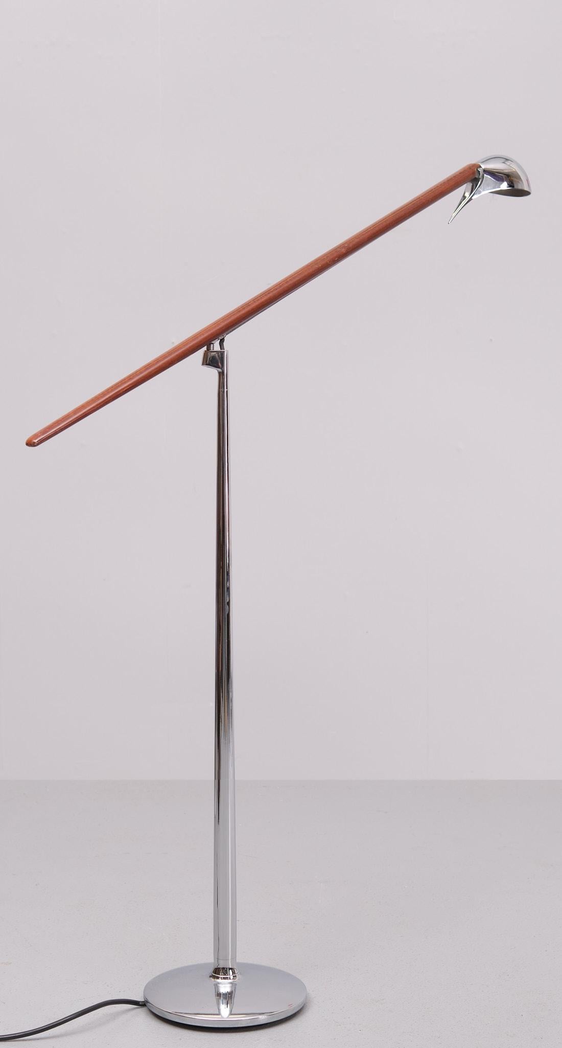 Very nice rare Jorge Pensi floor lamp .for B.Lux  1980s Spain                  Model Bluebird . Tapering Chrome upright . Mohagany  Swing  arm 
comes with a Snake head shaped Halogen lamp holder . 
