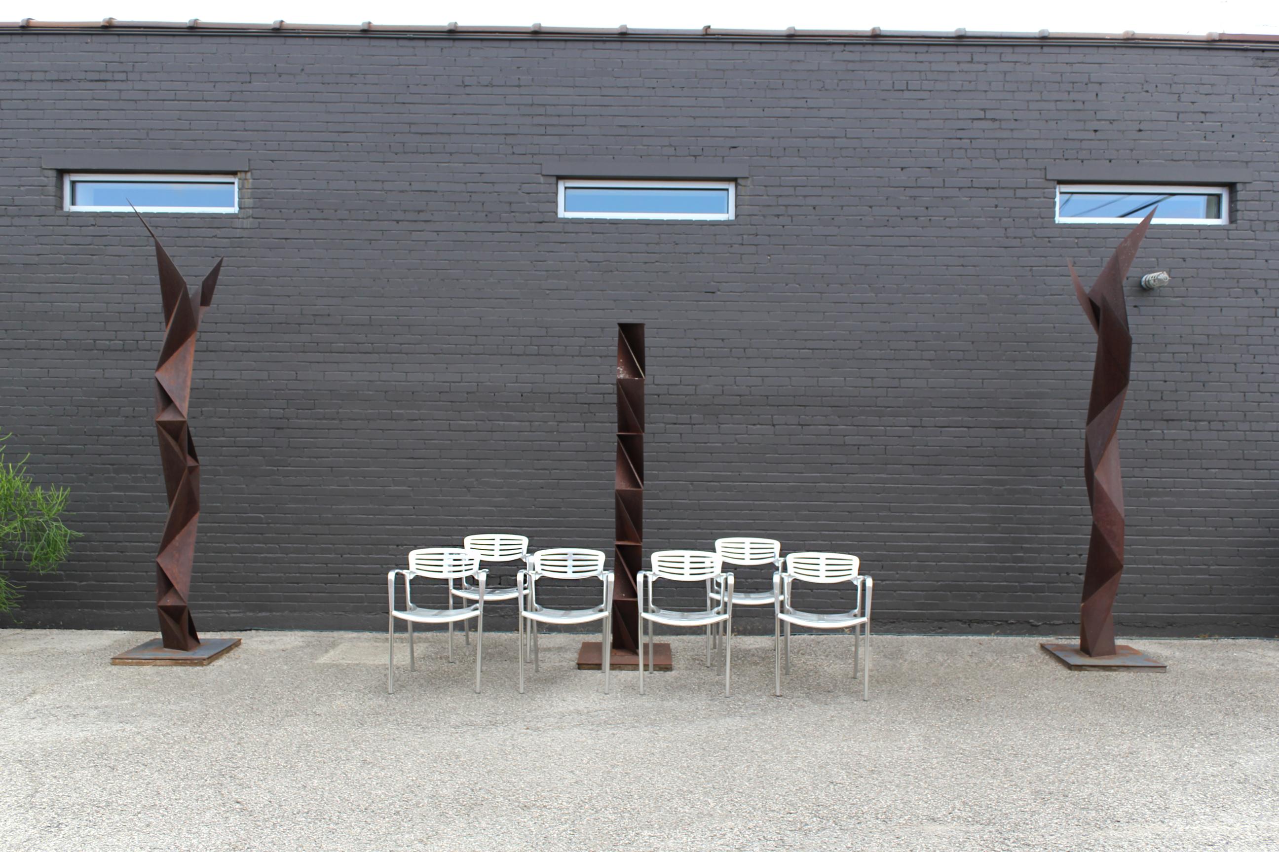 Gorgeous set of six stackable Toledo chairs in solid cast aluminum. Suitable for indoor or outdoors.