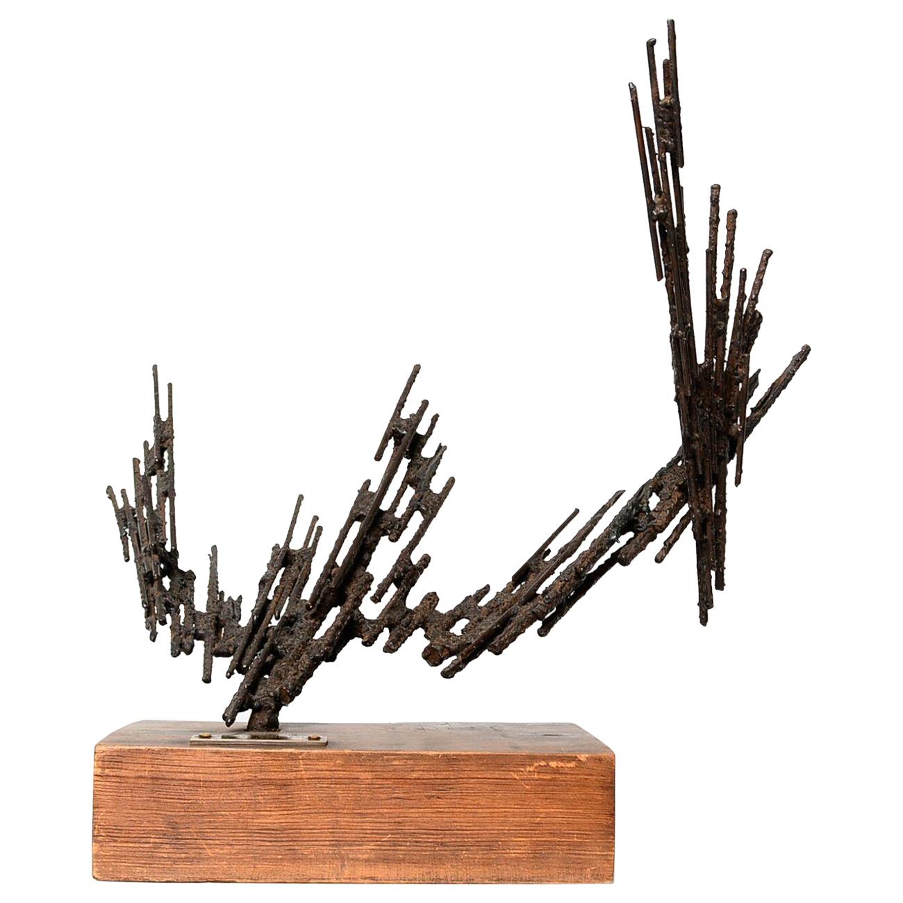 Art Sculpture
Brutalist Bronze Iron Sculpture by Jorge Stanyo Kaminsky (Mexican Artist).
Abstract iron sculpture on a rectangular wood base.
DIMENSIONS 20.5 in. H x 24 in. W x 12 in. D
Bronze label dated 1977. Artist's initials underneath wood