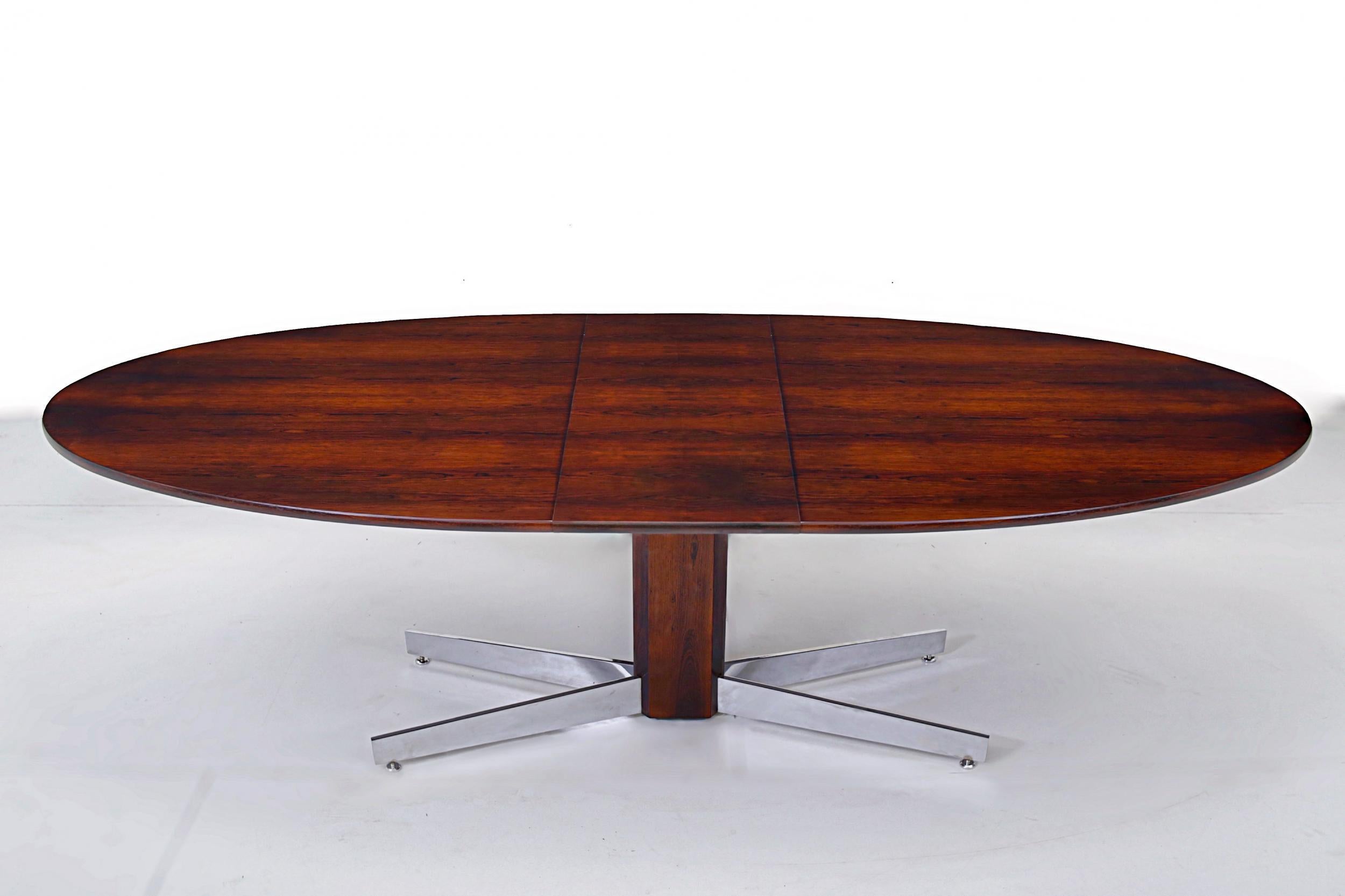 Brazilian rosewood dining table with stored leaf on chrome pedestal base. Designed by Jorge Zalszupin for L'Atelier. Brazil, 1960. Fully restored/refinished. Top measures: 95