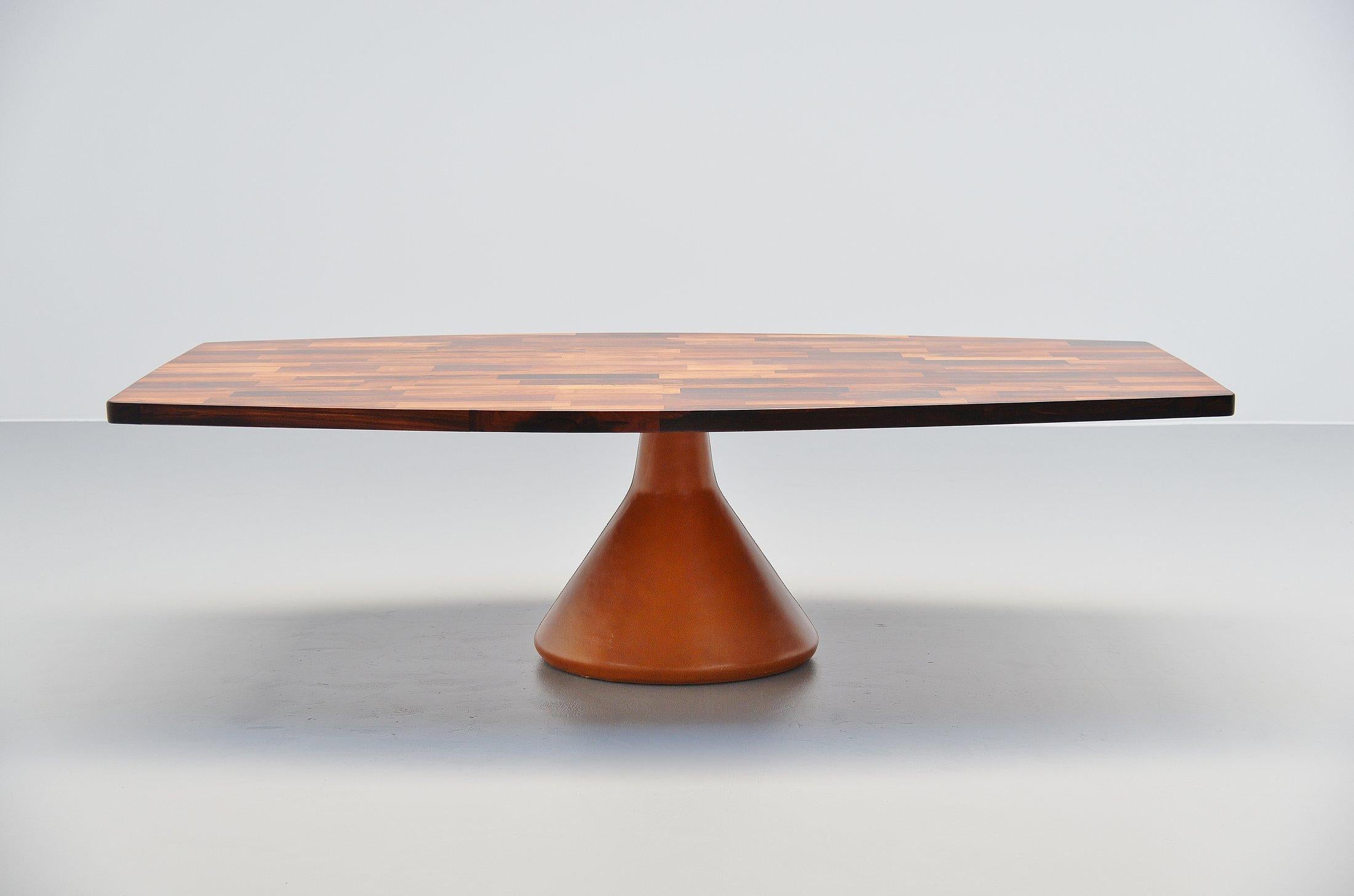 Spectacular so called Guanabara dining table designed by Jorge Zalszupin and manufactured by l'Atelier, Brazil, 1960. This stunning large table has a rosewood patchwork top supported by a solid concrete base, covered with cognac leather. A thick