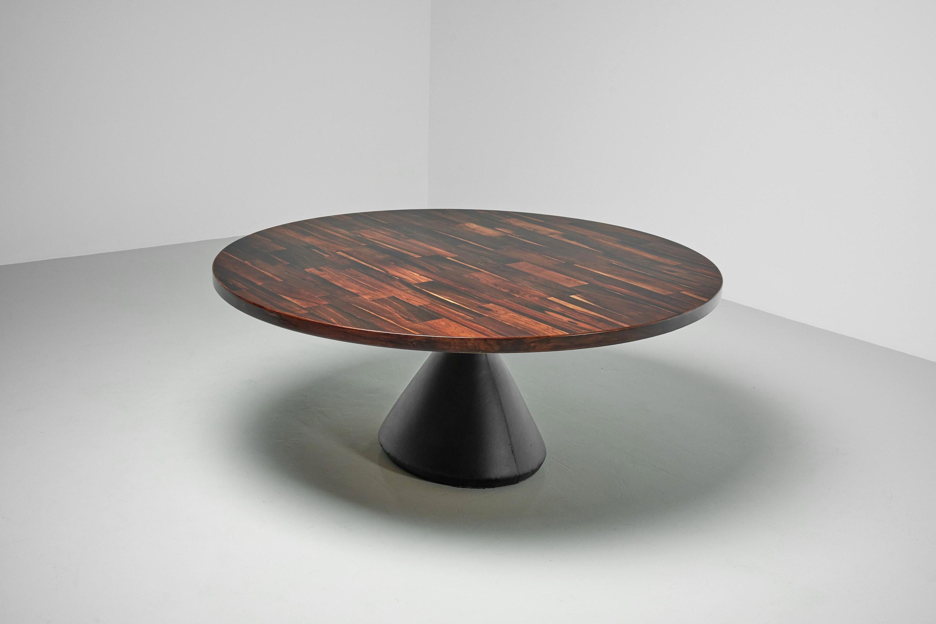 Monumental so called Guaruja round pedestal table designed by Jorge Zalszupin and manufactured by his own company l’Atelier, Brazil 1959. This stunning large dining table has a rosewood patchwork top supported by a solid concrete base, covered with