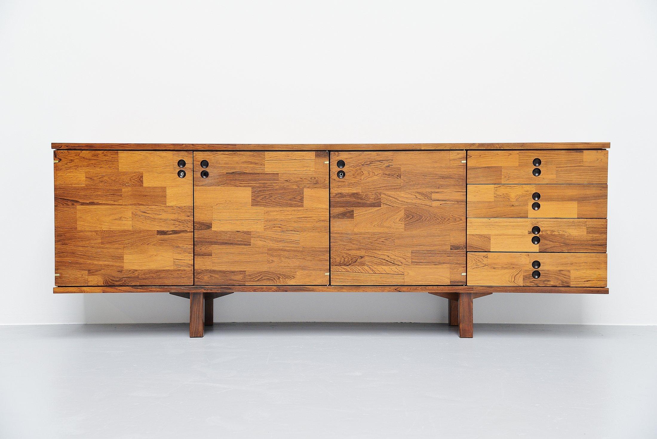 Stunning small credenza designed by Jorge Zalszupin and manufactured by l'Atelier, Brazil 1970. The credenza is made of patchwork jacaranda veneer, the idea to do us this patchwork veneer came from the use of left-over scraps of wood available at