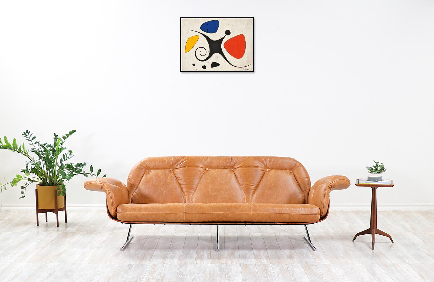 Iconic “Presidencial” sofa designed by Jorge Zalsupin for L’Atelier in Brazil, circa 1960s. This rare and sophisticated sofa is comprised of a rosewood frame and enameled steel and chrome-plated steel sled legs. The incorporation of various