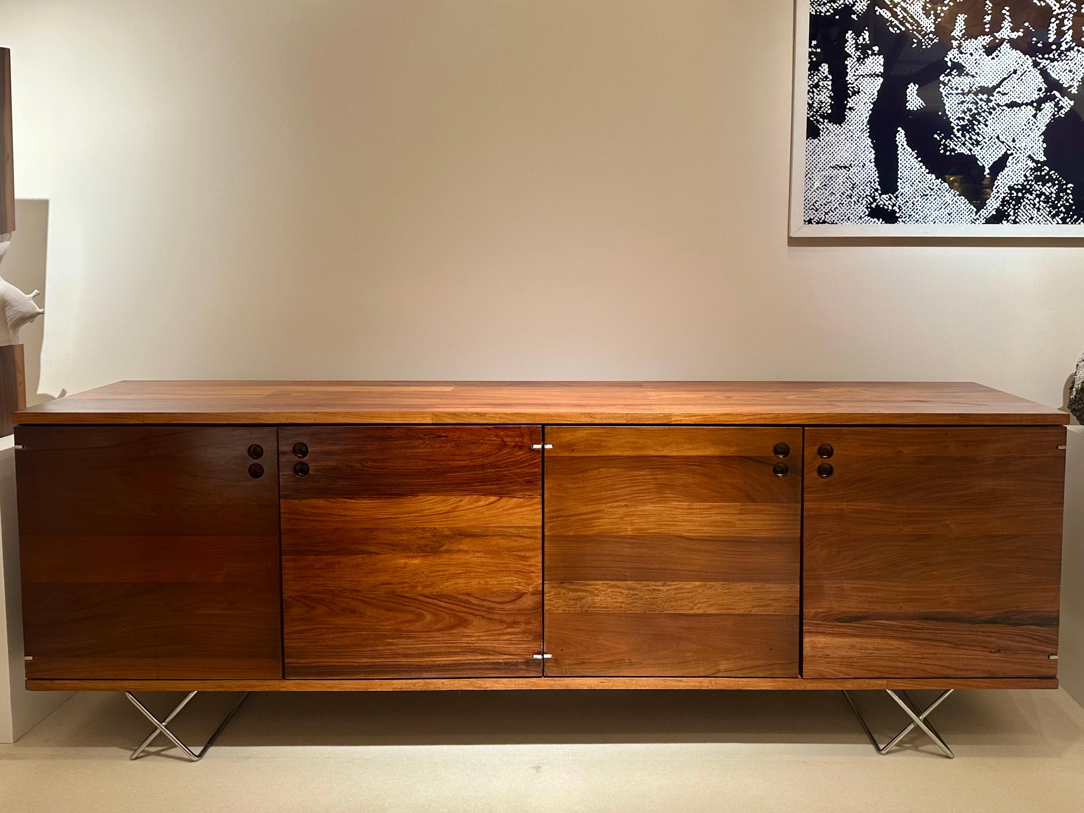 Jorge Zalszupin (1922–2020)
“Componível” Sideboard, c. 1960
Solid freijó wood, freijó veneer, and metal
Dimensions: 70 × 200 × 40 cm (27 9/16 × 78 3/4 × 15 3/4 in)

Designed in the 1960s, this sideboard perfectly balances functionality and elegance