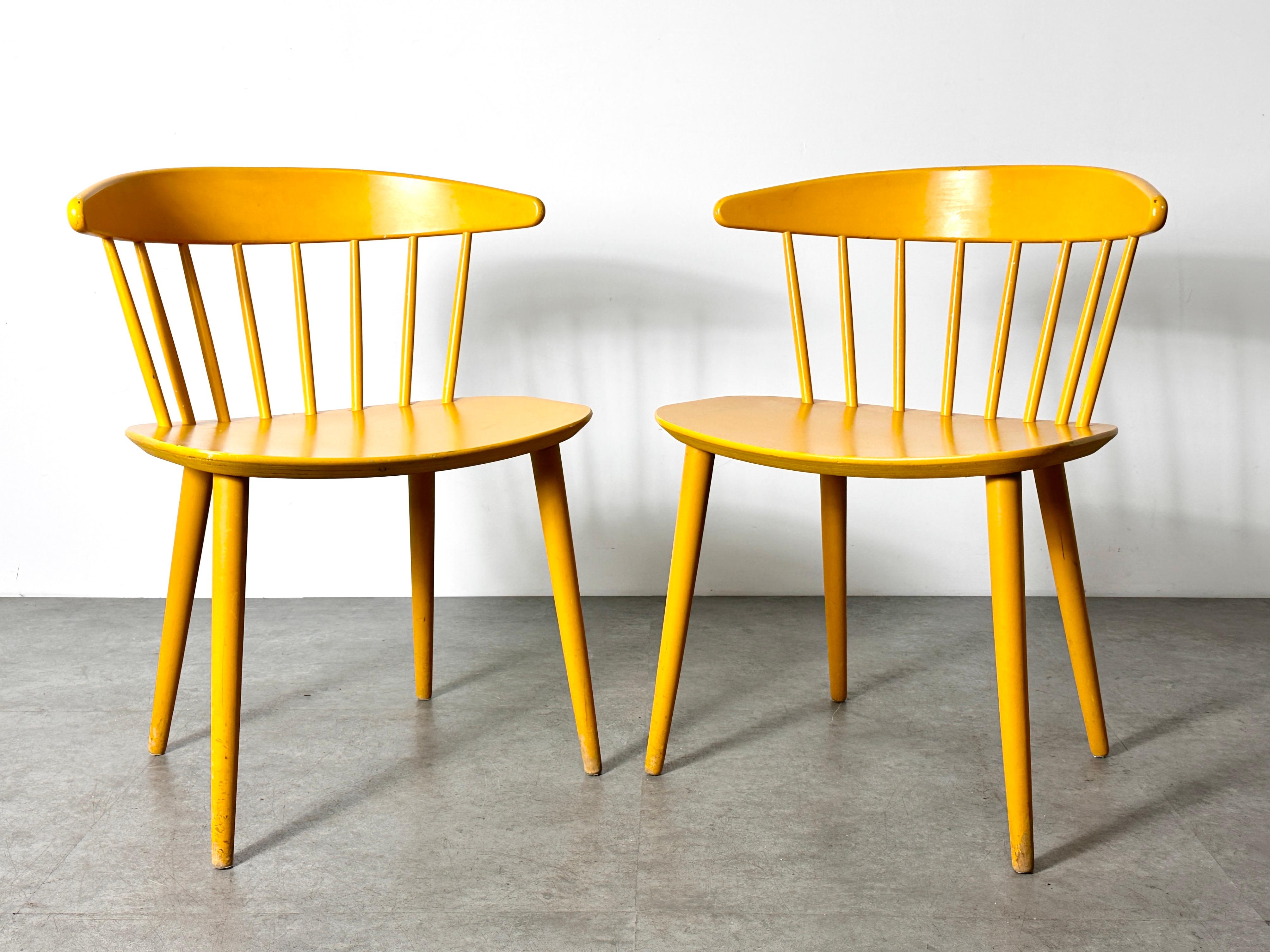 A pair of original model J104 chairs designed by Jorgen Baekmark for FDB Mobler 1960s
Solid wood in uncommon original yellow finish
Signed with manufacturer impressed mark to underside