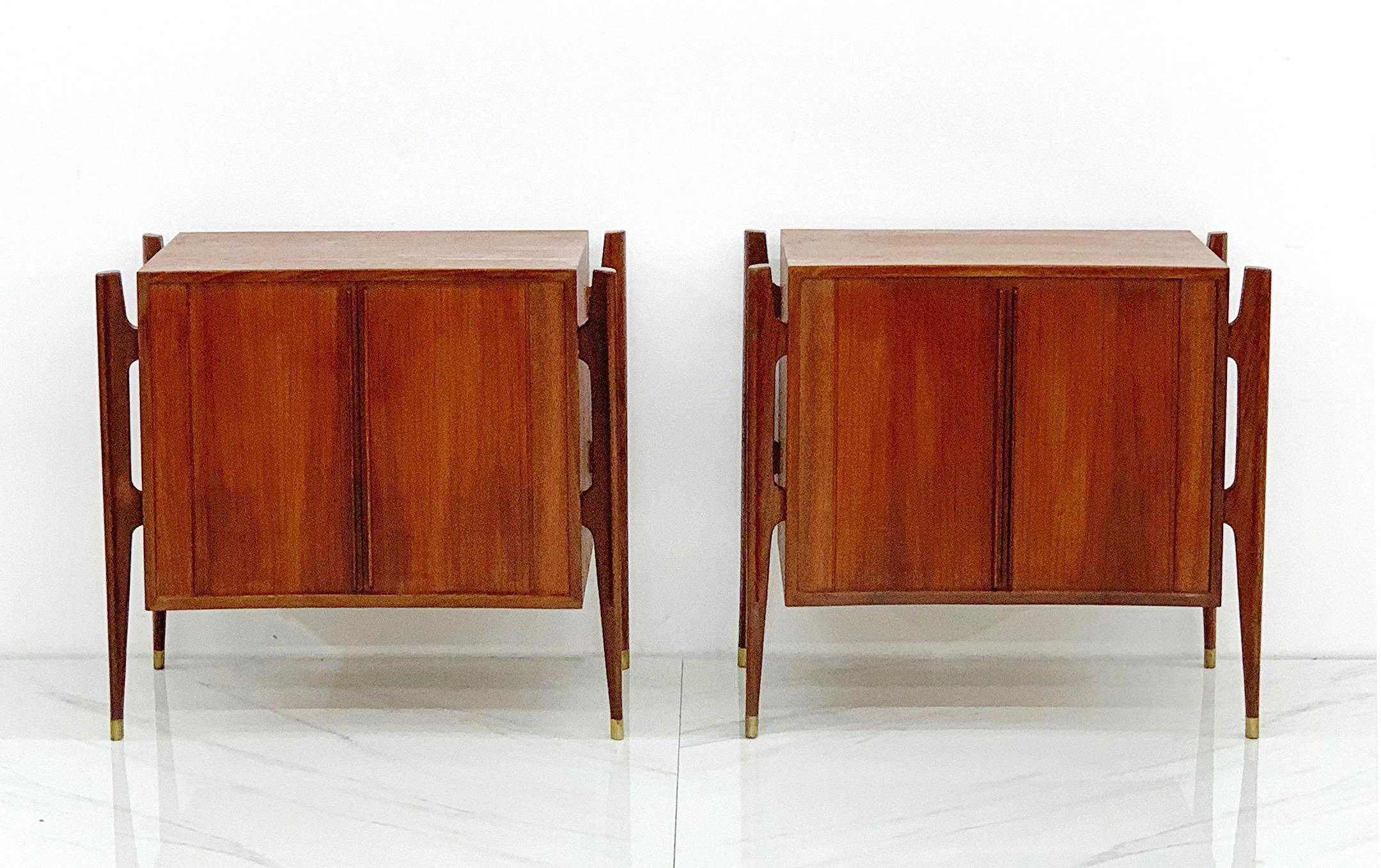 An exceptional and extremely rare pair of 1950's Mid-Century Modern nightstands, or can also be used as side or end tables, designed by Jorgen Clausen for Brande Møbelfabrik, Denmark c. 1950. Often misattributed to Edmond Spence, this gorgeous pair