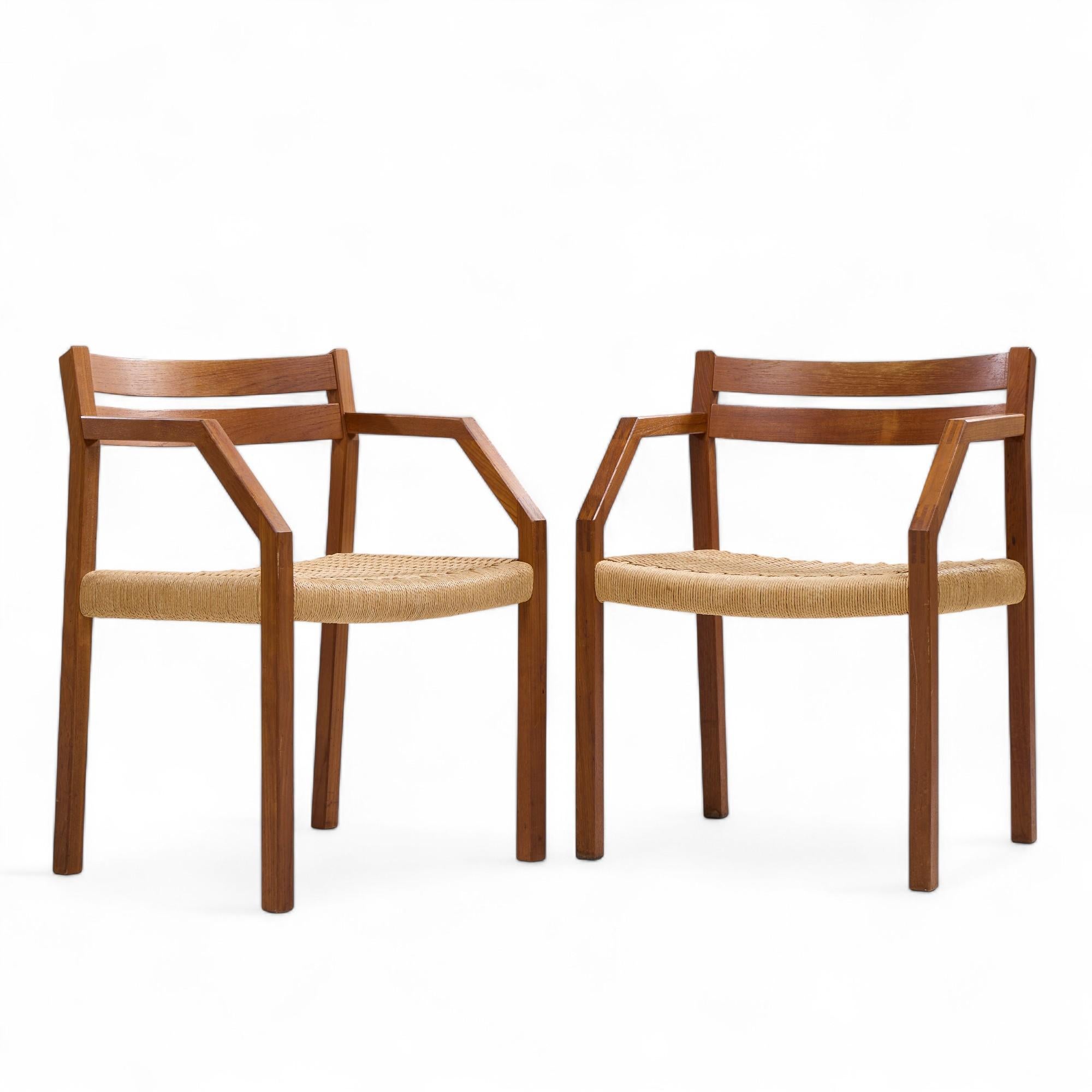 Jorgen Henrik Moller for J.L. Moller Mobelfabrik Mid Century Danish Teak and Paper Cord Dining Chairs - Pair

Each chair measures: 22.5 wide x 20 deep x 30.5 inches high, with a seat height of 17.25 and arm height/chair clearance of 26.5