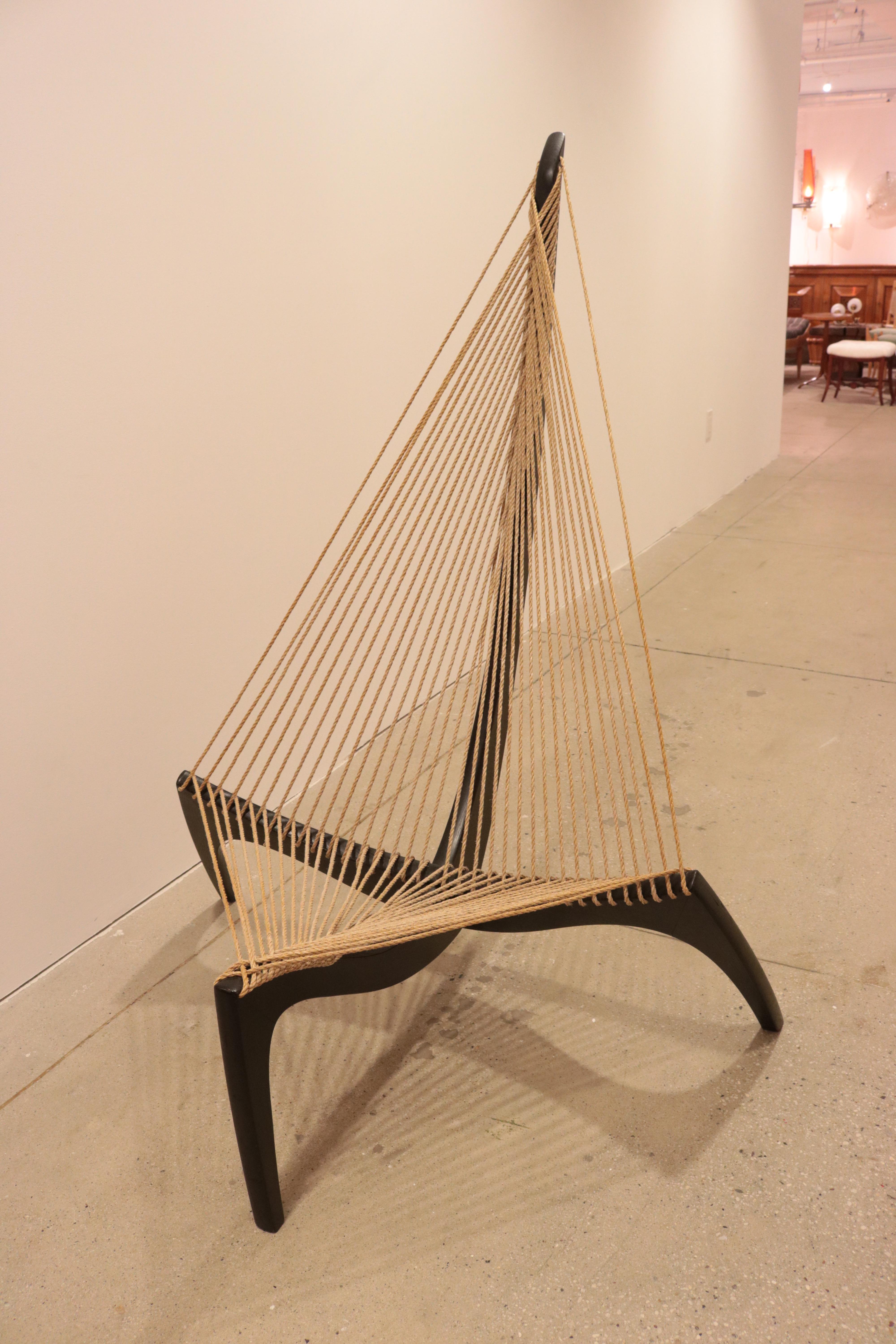 A sculptural Jorgen Hovelskov designed harp chair.
Solid oak and rope.
  